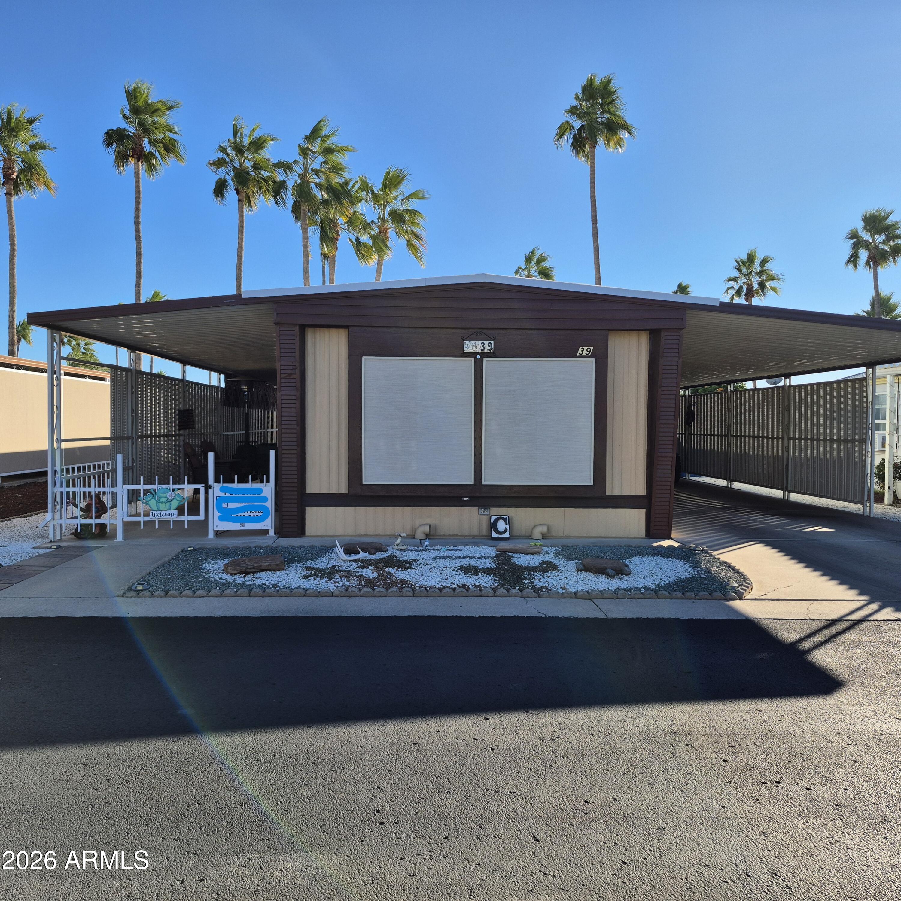Located in the beautiful, quiet, and impeccably maintained Holiday Palms Mobile Home Park in Mesa, Arizona, this charming two-bedroom, one-bath mobile home offers comfort, pride of ownership, and an inviting community atmosphere.
With nearly 900 square feet of living space, the home features newer items - AC 3 yrs- New Floors 2 yrs-  Roof Recoated 3yrs - The park is known for its friendly office staff, well-kept grounds, and attractive amenities, making it an ideal place to be home. This is a wonderful opportunity to enjoy peaceful living in one of Mesa's clean and welcoming mobile home communities.