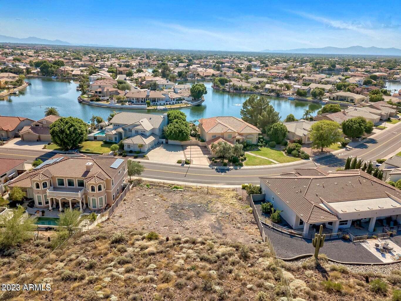 Rare Find in Arrowhead Lakes!  An Entertainers Dream Home by AslanHomesUSA.  This premium mountainside lot  Includes architectural plans fully approved by HOA design committee.  Buyer can take over with builder and choose all finishes.  Please note* Photos  provided to illustrate its approximate finished appearance.

Nestled against the mountainside, this coveted lot offers a perfect blend of natural beauty and urban convenience. Your backyard? A serene mountain escape with hiking and biking trails steps away.  Stunning views of the city skyline, sparkling lakes, and majestic mountains. 

Close to world-class golf, top-tier shopping, and vibrant entertainment, this location is unbeatable.  Don't miss this opportunity to secure one of the last premium mountainside lots today!