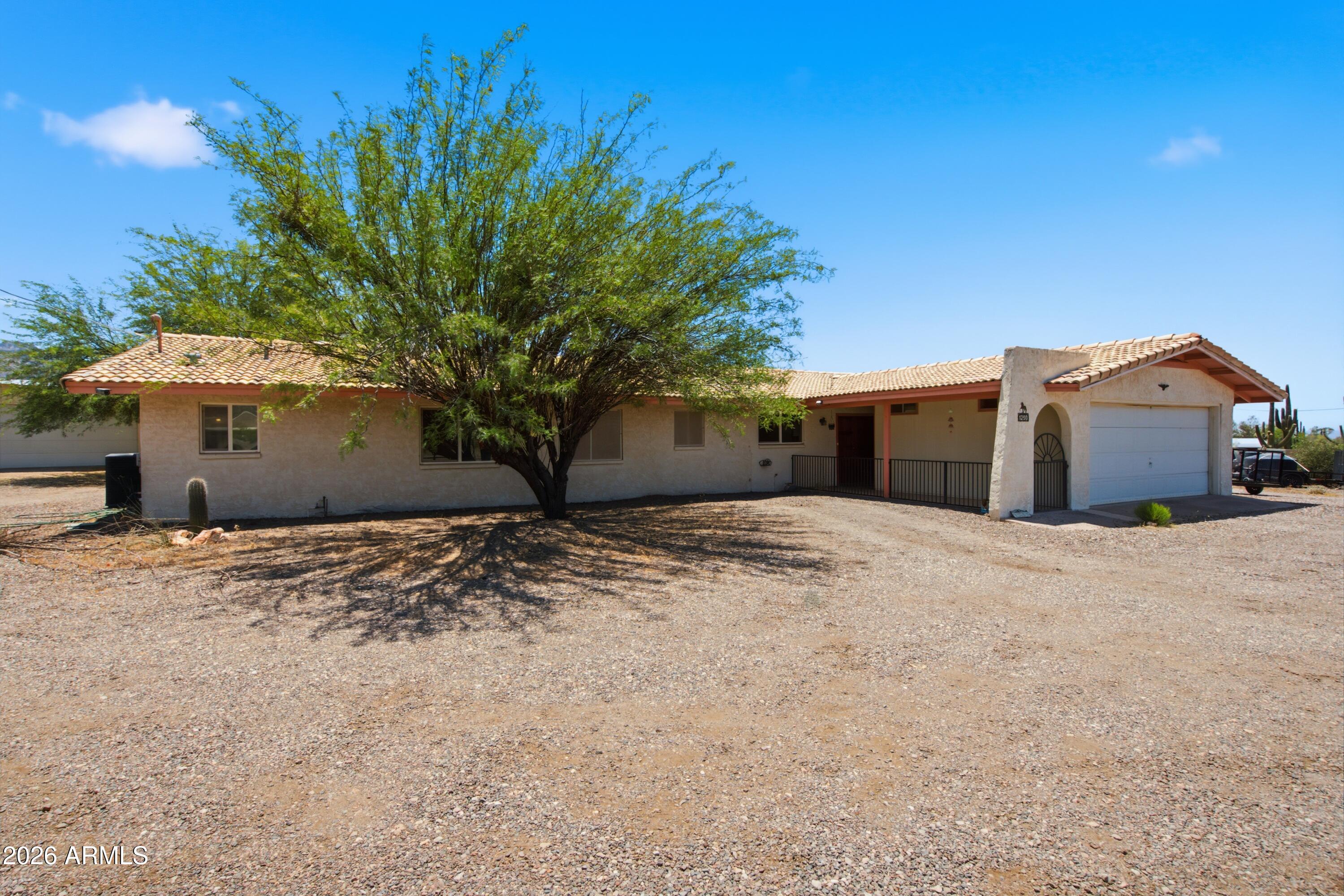 Opportunity awaits in the heart of Apache Junction! Situated on a spacious 2 acre lot with stunning views of the Superstition Mountains, this property offers the perfect blend of privacy, freedom, and Arizona living. Whether you're looking for a primary residence, investment opportunity, or a property to customize and make your own, the possibilities are endless.

Enjoy the benefits of no HOA, ample outdoor space, and room for your toys, RV, animals, or future improvements. The home offers a functional floor plan with abundant natural light and a comfortable living space ready for your personal touches. Conveniently located near hiking and outdoor recreation, including Lost Dutchman State Park and the Tonto National Forest, while still providing easy access to shopping, dining, schools, and major commuting routes.

If you've been searching for an affordable Arizona property with mountain views, space to grow, and the flexibility to create the lifestyle you want, this is one you won't want to miss!