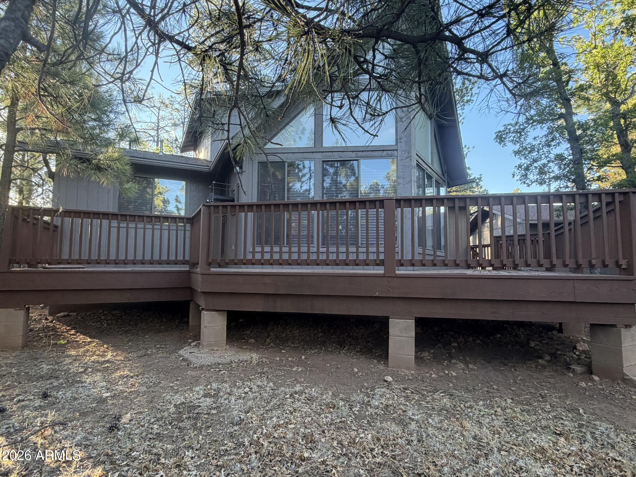 Welcome home to your place in Happy Jack, Arizona mountains!   This home is move in ready, with a NEW ROOF and REFINISHED DECK, 
Features of this home on ONE ACRE   include,  2 BEDROOMS, 2 BATHS, a LOFT, huge LAUNRDY ROOM, 2 CAR GARAGE.
There are two huge deck/patios that are the length of the home and a fenced back yard.  Enjoy nature, trails, lakes and more. 
This community has an HOA with a community clubhouse.  Horses are allowed.  There's always events going on in the community.   There is a community church and  fire department as well.   
All furniture can be sold with the home if the buyer chooses
