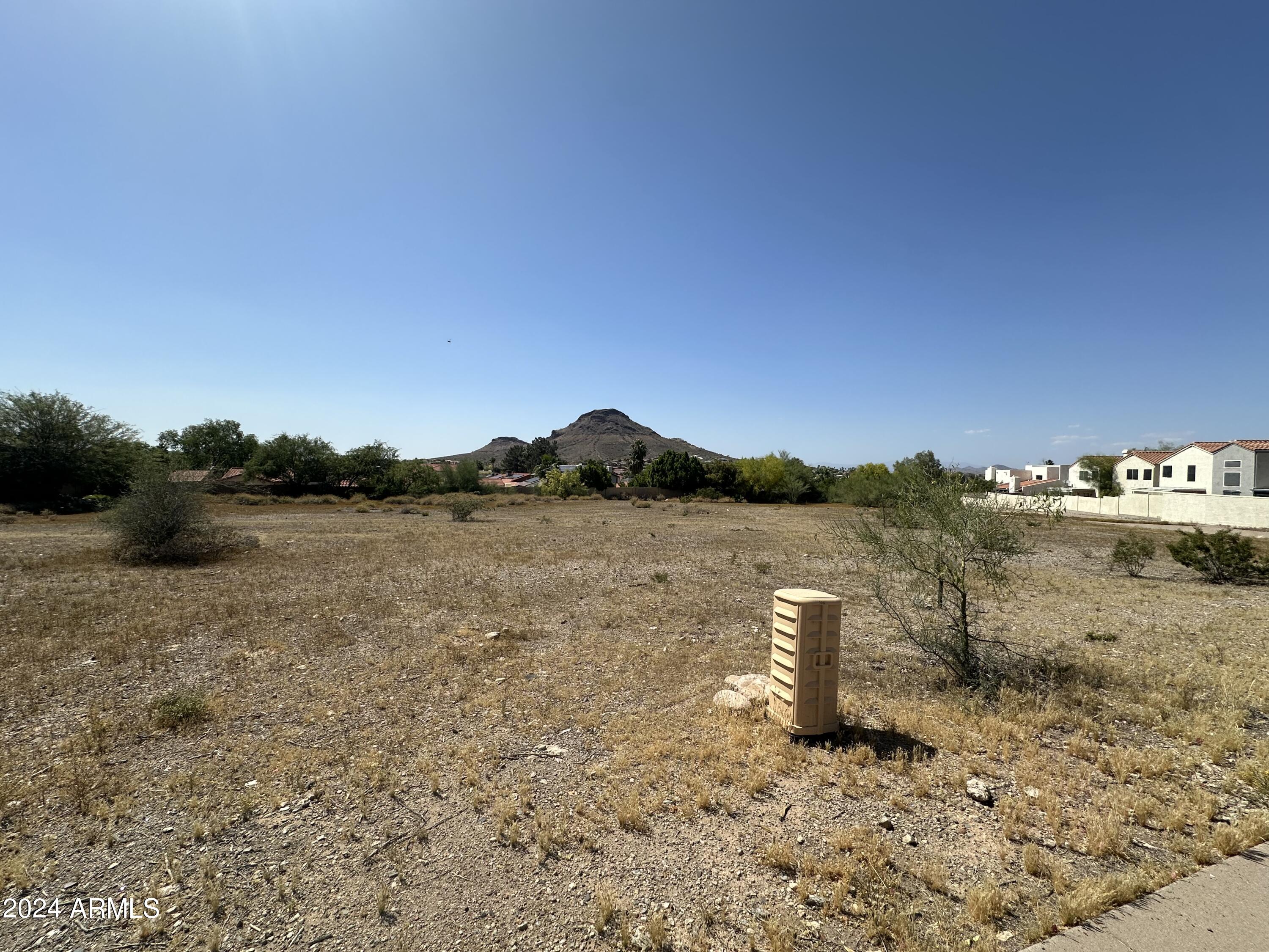 North Phoenix development on a rarely offered C-2 Zoned lot with frontage on Cave Creek Road. One of the last few vacant lots on Cave Creek Road can be yours. High traffic area along Cave Creek Road with numerous businesses and supporting residential including multi-family and luxury homes.  One of the most desirable Zoning Types, C-2 allows for tremendous flexibility and options for a wide variety of businesses! Mountain Views add to this amazing lot and all the options/opportunity! 
Close to Cactus Road, Greenway Pkwy and Bell Road, Loop 101 and SR-51 are also just 5 minutes away. Seller Carry or Joint Venture for the right buyer/opportunity.
Self Storage, Retail, School, Daycare, Automotive, Residential multi family, Office, Flex warehouse, so many options! Traffic Analysis
Cave Creek Road near this location (around the intersection with Loop 101/SR-101) sees high daily traffic, supporting the listing's claim of a "high traffic area." Recent data indicates an average annual daily traffic (AADT) of approximately 90,000-96,000 vehicles, making it suitable for businesses relying on visibility and foot traffic.
C-2 Zoning: Allowed Uses and Flexibility
Phoenix's C-2 zoning (Intermediate Commercial) is designed for a wide range of commercial activities, with many uses permitted outright or via a use permit. It emphasizes flexibility for businesses while requiring most operations to occur within enclosed buildings (except where specified). This aligns with the listing's highlights of "tremendous flexibility" for various options.
Key sections from Phoenix Zoning Ordinance Section 623:

Permitted Uses (outright allowed, including all uses from lower-density districts like C-1, R-3, R-4, R-5 for residential components):

Retail sales (e.g., antiques, architects' supplies, automobile parts, building materials, clothing, florists).
Offices and professional services (e.g., contractors' offices, dental labs, engravers).
Automotive-related (e.g., auto parts sales, seat covers/trim shops, rental with limitations).
Wholesale and storage (e.g., beverages, chemicals, dry goods, frozen foods, furniture repair/refinishing).
Multi-family residential (permitted as in R-3/R-4 districts, including apartments).
Educational and care facilities (e.g., schools, daycaresoften as accessory or with conditions).
Warehousing/flex space (e.g., bank vault storage, cleaning plants, contractors' supplies).
Other: Assembly halls, bowling alleys, car washes, family game centers, medical labs.


Uses Requiring Use Permits (conditional approval needed, often with site-specific reviews):

Auctioneers' auditoriums, bus terminals, exhibition halls.
Adult-oriented businesses (with strict location restrictions).
Outdoor activities or larger assembly halls (25,000 sq ft).
Compressed natural gas sales at service stations.
Certain manufacturing or processing (e.g., bakers' goods, bookbinders).


Accessory Uses (allowed secondary to primary uses):

Massage therapy in beauty shops.
Blood banks/plasma centers accessory to hospitals.
Outdoor dining or events (with permits in some cases).


Restrictions:

Most uses and storage must be within closed buildings.
No on-site maintenance/fueling for certain operations (e.g., auto rentals, bus terminals).
Distance requirements for sensitive uses (e.g., adult businesses must be 500-1,320 feet from schools, parks, residential zones).
Environmental/safety standards (e.g., non-combustible cleaning agents, no bottling for beverages).
Residential uses are permitted but must comply with multi-family standards from lower districts.



The suggested uses in the listing (self-storage, retail, school, daycare, automotive, residential multi-family, office, flex warehouse) are generally permitted or allowable with a use permit under C-2, confirming the "desirable" zoning claim.
Development Potential and Considerations
This lot's rarity as one of the few vacant parcels on Cave Creek Road, combined with mountain views and proximity to highways, positions it well for commercial or mixed-use development. High traffic could benefit retail or service-oriented businesses, while C-2's flexibility supports the listed options.
