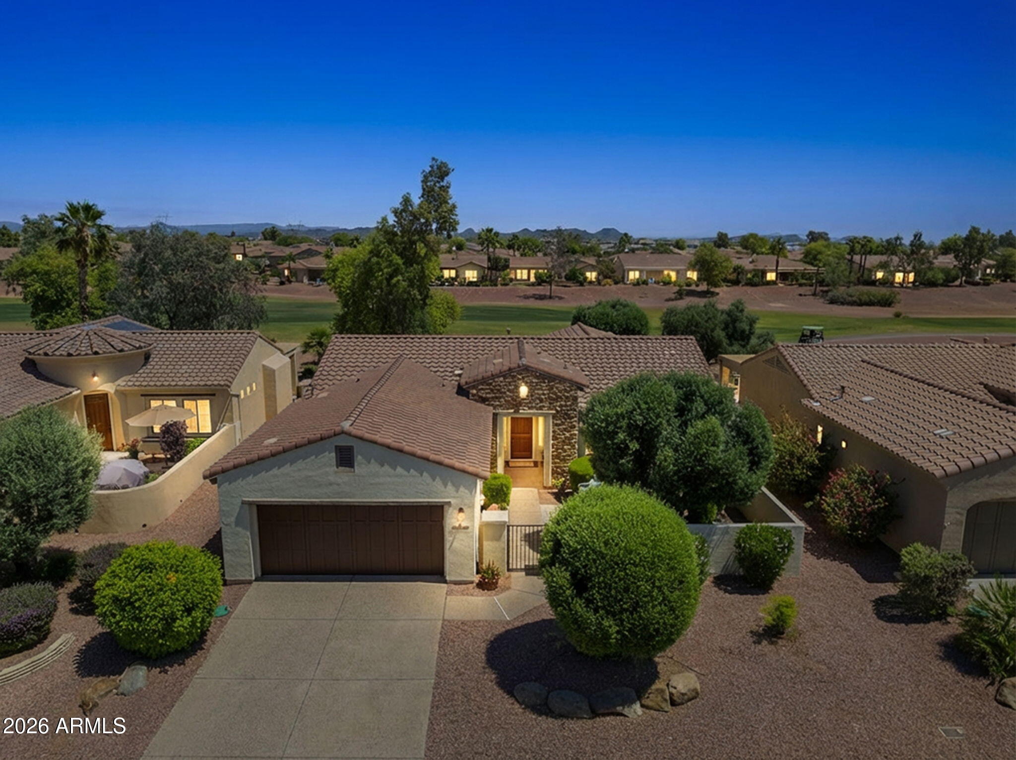 Price Reduction - Owner Ready to Move! Here's a great chance to own a mid-size home in Corte Bella right on the lush green fairway! 1837 Sq Ft San Ysidro plan sits on the 6th fairway and has an East-facing backyard, perfect for enjoying Arizona's colorful sunrises. The extended patio is ideal for outdoor gatherings. Inside, you'll find an open great room and a spacious island kitchen with a gas range and granite counters. Casual dining area + space for a large table. Two bedrooms plus a den with a view of the course. Tile floors run throughout the home except in the bedrooms. A front courtyard adds curb appeal & privacy.  Extended 2-car garage has an epoxy-coated floor. Grocery stores are just a golf cart ride away! Corte Bella has 2 bars and restaurants inside the gates. This vibrant boutique Del Webb community offers golf, pickleball, tennis, a fitness center, a heated pool, and a day spa. A social director plans fun social activities, including concerts and excursions.