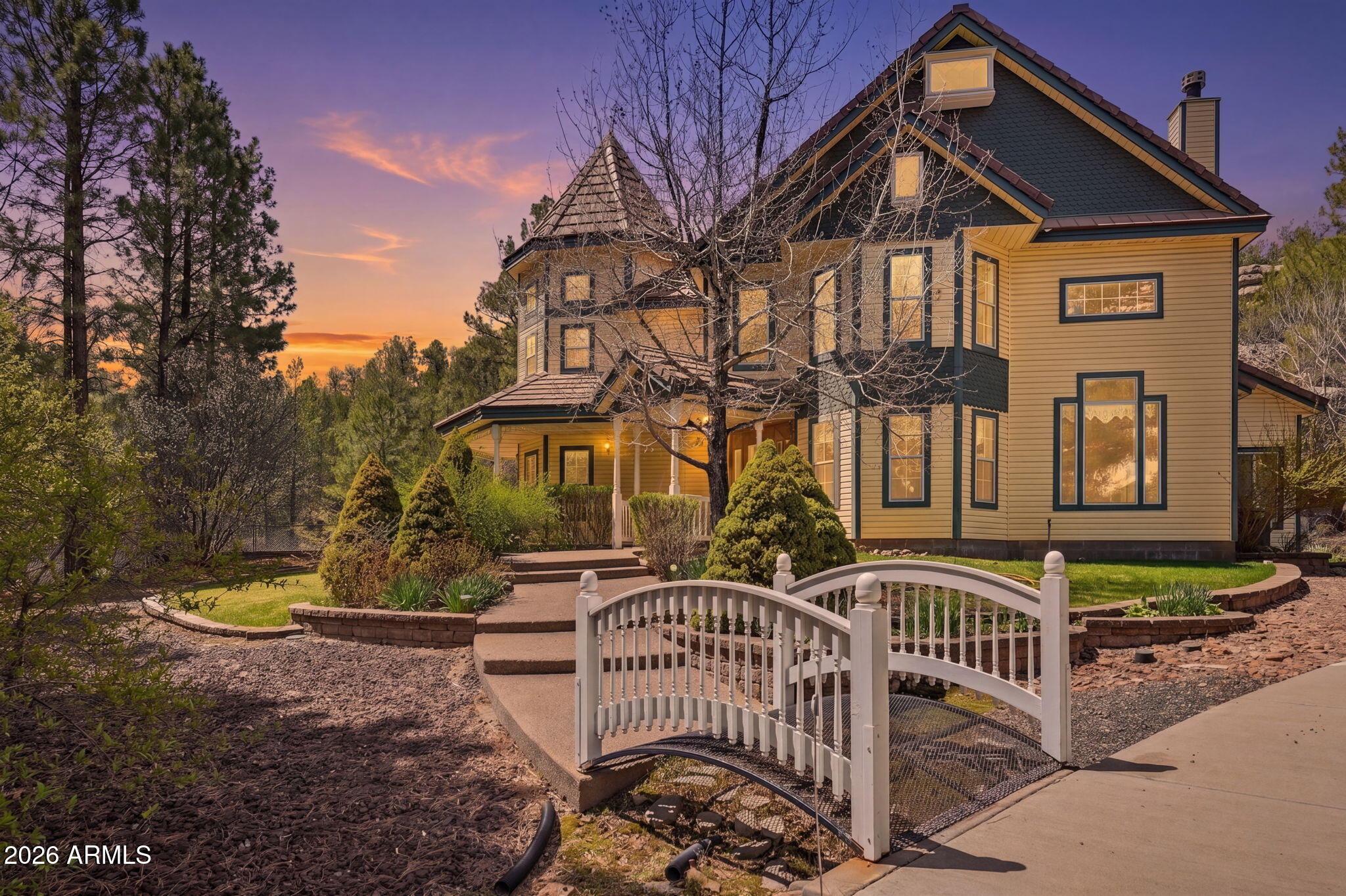 Beautiful Queen Anne Victorian style home sitting on a large parcel near forest land. The home is setup to be both a refuge and a retreat. Lots of pine trees and beautifully landscaped as you walk up to front door. As you enter you'll be greeted with a spacious two-story height ceilings in the entry, family room, and parlor. The kitchen plan is open and has two refrigerators. Lots of natural interior light with the Family Room having canyon views. Boasts a screen porch and attchd green house. The detached garage also has a fourth bedroom above with it's own full bath. The property can be self-sustaining with solar, a propane generator, and well water.. as secondary to city electric and city water. The parcel the home is on is 1 acre and the sale includes another 4 acre parcel up the hill.