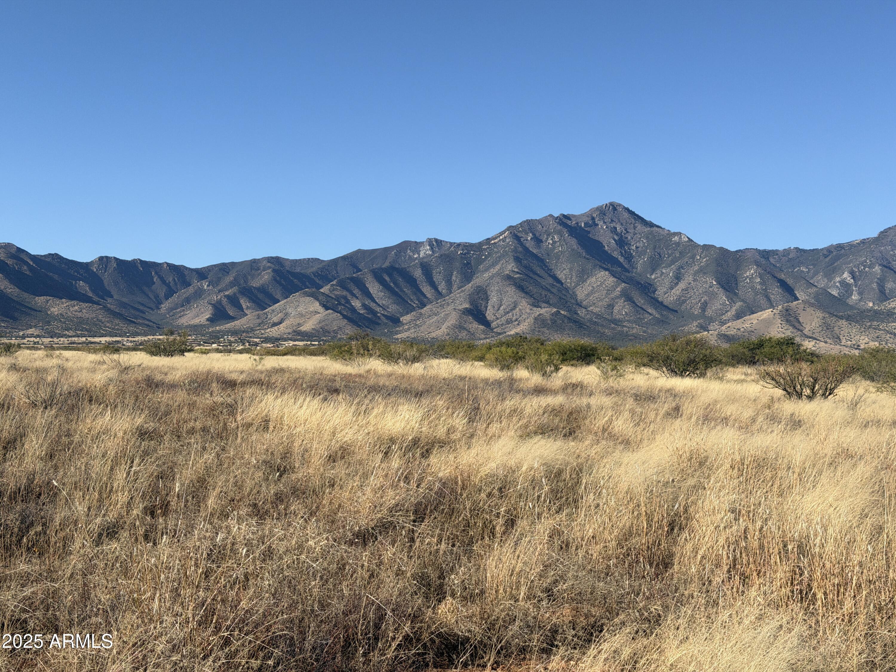 Set on 15.98 acres of level, unspoiled land, this property offers sweeping, breathtaking views; the kind of rare, cinematic beauty that stops you in your tracks. The HOA is detailed and design-focused, with guidelines to protect the natural landscape and preserve the very views that make this property extraordinary. This is an excellent fit for those who value long-term protection of the land and are comfortable building within defined standards. Take the opportunity to visit and soak in the beauty for yourself! You'll find the views, and the protection behind them, are well worth the minimal HOA fee. This is raw land, full of potential for building your dream home! Properties with this combination of scale, setting, and uninterrupted horizon are increasing rare.  Make it your own today!