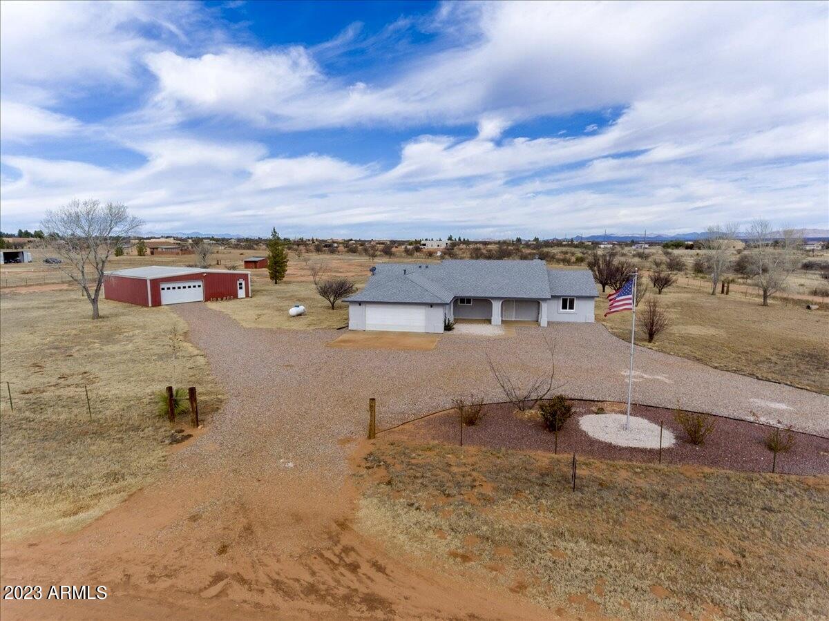 Stunning 4 acre property, site built home that features a split floor plan with 3 bedrooms, 2 bathrooms, an oversized 2 car garage (epoxy floors), huge open concept living, upgraded kitchen, covered back patio, and more!  Plus this property has a 39x38 foot steel framed metal building with slab foundation and electrical. Many updates: AC, roof, water heater, windows, etc.  This one is a catch!