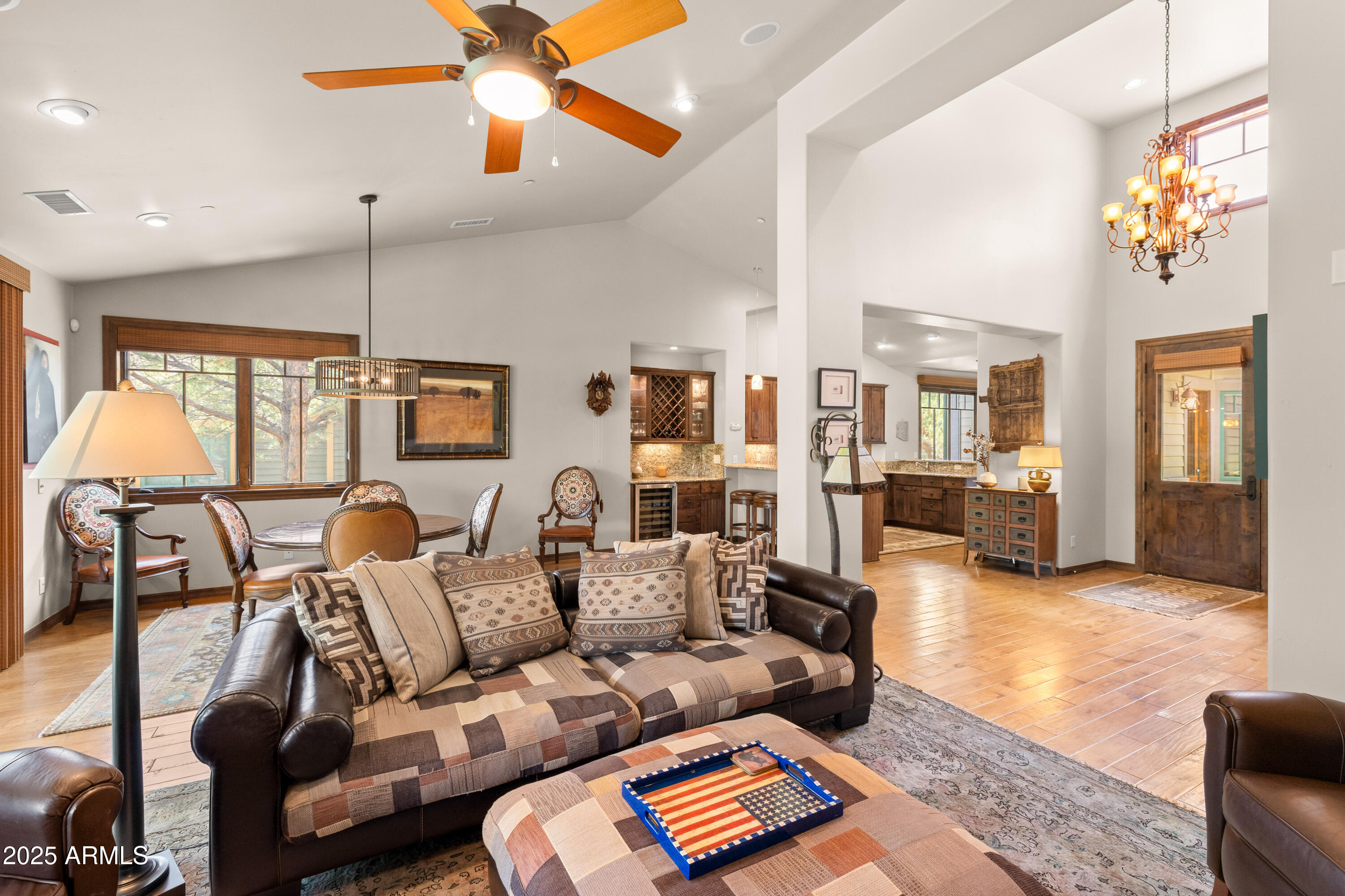 Set against the backdrop of the 12th fairway at Pine Canyon, this 3,110 sq ft Elk Pass townhome offers refined mountain living with unmatched golf course views and thoughtful design throughout. With 3 bedrooms, 3.5 bathrooms in the main home and a private 1-bedroom, 1-bath casita with a separate entrance, this residence is ideal for hosting family and guests in comfort and style. The main level welcomes you with warm wood flooring, vaulted ceilings, and expansive windows that flood the space with natural light. A floor-to-ceiling stone gas fireplace anchors the great room, creating a cozy yet elegant setting that opens to a large Trex deckcomplete with built-in BBQperfect for entertaining or simply soaking in the panoramic golf course views.
The gourmet kitchen is a chef's dream, outfitted with professional-grade Viking appliances, a six-burner cooktop, separate wall oven, a butler's pantry with wine refrigerator, and a charming breakfast nook. The spacious primary suite, also on the main level, features private deck access and a spa-like bath with Jacuzzi tub, separate shower, dual vanities, and a generous walk-in closet.
Downstairs, the walkout basement features two additional bedroomsone en suiteand a large family room with a stylish wet bar. Both bedrooms enjoy direct access to the lower patio, showcasing the serene views of the 12th fairway.
Whether you're relaxing indoors, entertaining guests on the deck, or enjoying the privacy of the casita, this Pine Canyon townhome offers a seamless blend of comfort, elegance, and lifestyle.
Furnishings are available on a separate bill of sale or with an acceptable offer, minus Sellers personal items.