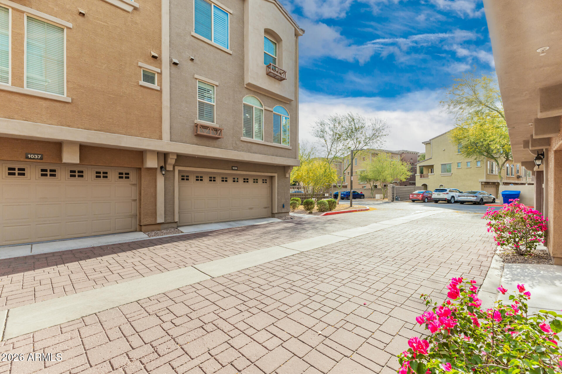 Modern Condo Living in the Heart of Downtown Gilbert. This beautifully updated condo in the gated community of Via Sorento offers the perfect blend of contemporary style, comfort, and unbeatable location. Just a short walk to vibrant Downtown Gilbert, you'll enjoy easy access to the weekly Farmers Market, award-winning restaurants, boutique shopping, the best nightlife, and freeway access . Dual Primary Suites, both generously sized bedrooms feature plush carpeting, private en-suite bathrooms, and custom closets with built-in organization. Gourmet Kitchen, open-concept design with shaker-style cabinetry, elegant crown molding, granite countertops, breakfast island, and stainless-steel appliances. Spacious & Bright Living Areas with neutral tile flooring throughout the main living spaces, abundant natural light, soft neutral paint, and top-of-the-line wood shutters on all windows. Private Balcony, Enjoy your morning coffee or evening relaxation on the shaded private balcony. Extra-Wide 2-Car Garage, With attached garage cabinets for maximum storage and organization. Community Amenities include Two sparkling community pools, fitness center, Walking paths, Children's playground, and sand volleyball. Prime Location End-Unit with extra windows and natural light. This low-maintenance condo is perfect for roommates, guests, or anyone wanting a lock-and-leave lifestyle in one of Gilbert's most desirable areas. Walk to everything Downtown Gilbert has to offer--no parking hassles required. Don't miss this rare opportunity to own a move-in-ready home with high-end finishes, modern updates, and an unbeatable price point this close to the action. Schedule your private showing today and experience Downtown Gilbert living at its best!