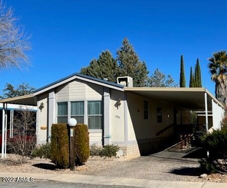 Enjoy the convenience of being close to shopping in Sierra Vista and the nearby medical center and hospital in this friendly gated community! This 2 bedroom/2 bathroom home has an open floorplan, large master suite with garden tub/shower, walk-in closet and built-in's for personal items. Backyard shed for storage, refrigerator and washer/dryer convey.  Home includes handicapped grab bars and easy entry access from carport with ramp to back door porch.