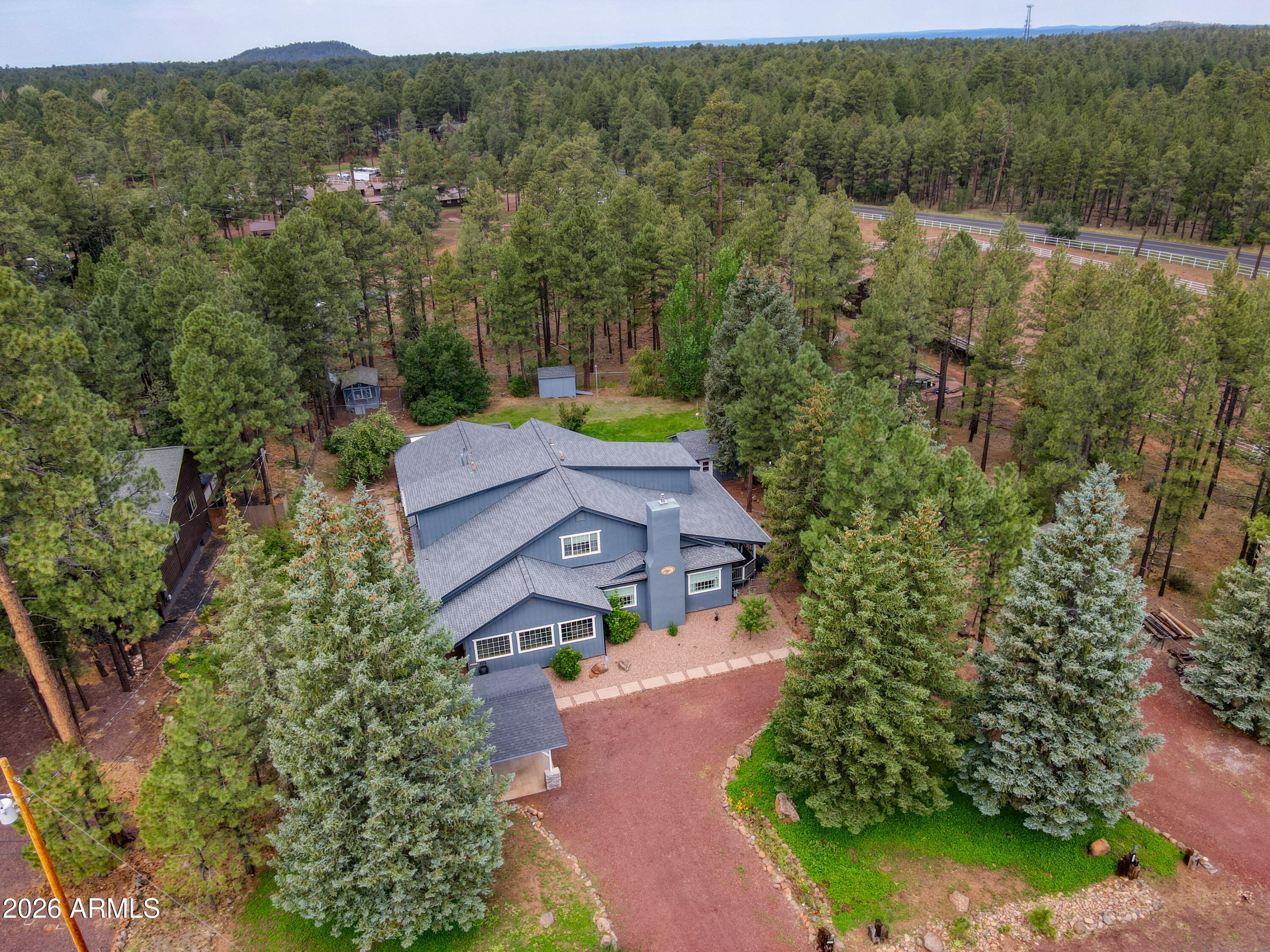 Beautifully restored and updated historic property in the heart of the Pinetop Country Club Area. 6 bedrooms 6 baths, office on 1.12 acres. Seller has made incredible improvements including the roof, heating, kitchenette, appliances, landscaping, carport, electrical, flooring, and interior finishes. Shows beautifully. Garden shed w/ new roof and 220 electrical. This home is extraordinary! Enter into foyer/reception, large living room w/ fireplace, master bedroom w/ sitting room and office. Gallery hallway with 3 bedrooms, 3 baths. Upstairs bedrooms w/ en suite bathrooms. Butler's pantry w/ quartz countertops, breakfast room w/ doors leading to pavered deck for entertaining. Trex decking. Freshly painted exterior. A gardeners delight w/ planters and drip system.