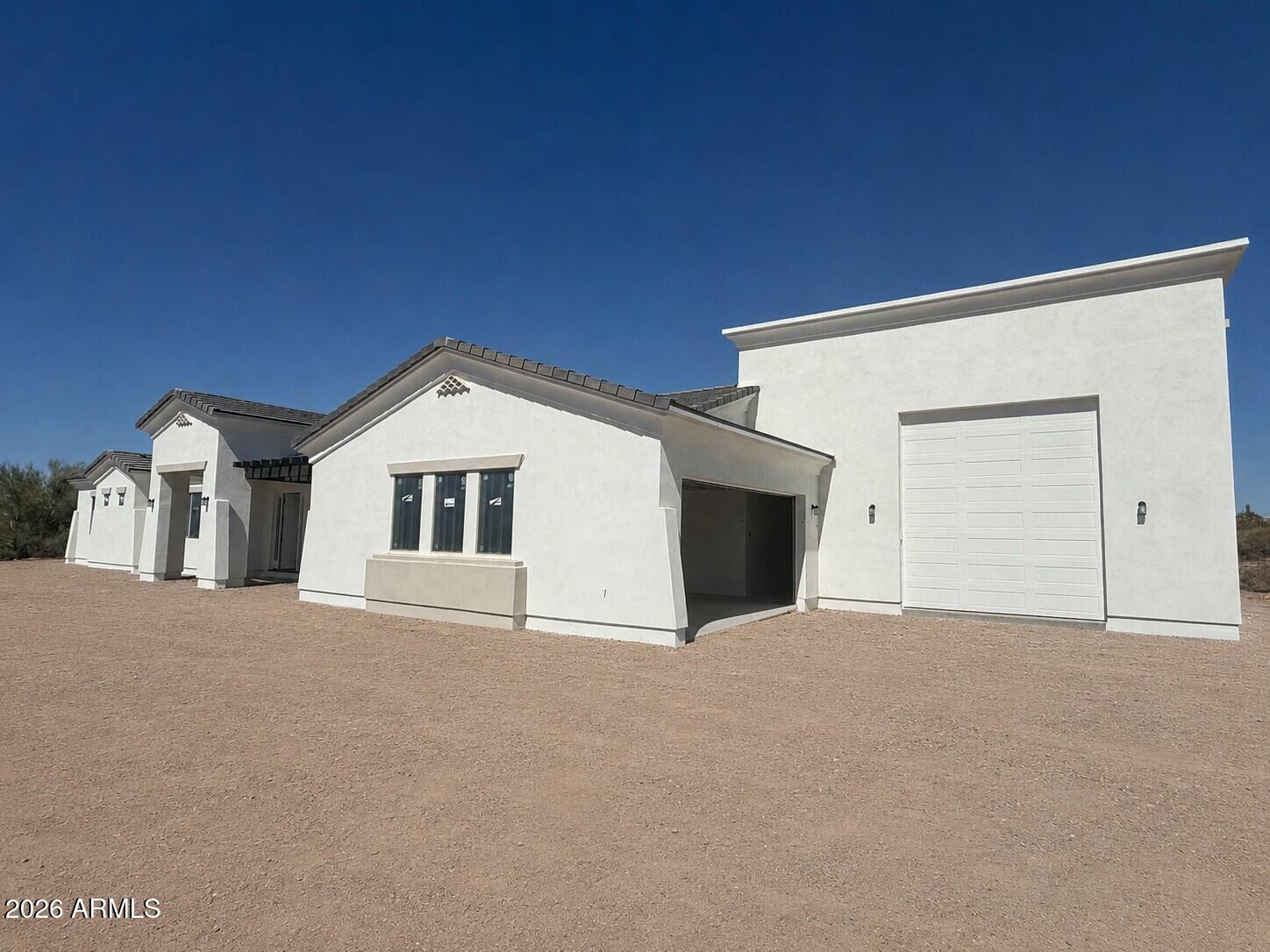 The final home in Arroyo Vista Estates is now available! Estimated completion is July 30. Enjoy breathtaking views of the iconic Superstition Mountains from this exceptional new home in one of Apache Junction's premier gated communities. We've saved the best for last, featuring an incredible approx. 30' x 50' RV Super Garage with 16' ceilings, a 12' x 14' door, plus an extended 2-car garage. Inside, you'll find designer finishes, a spacious open kitchen with double ovens and an oversized island, and a spectacular Great Room with a multi-sliding glass door opening to the covered patio. An ideal Arizona retreat or forever home.