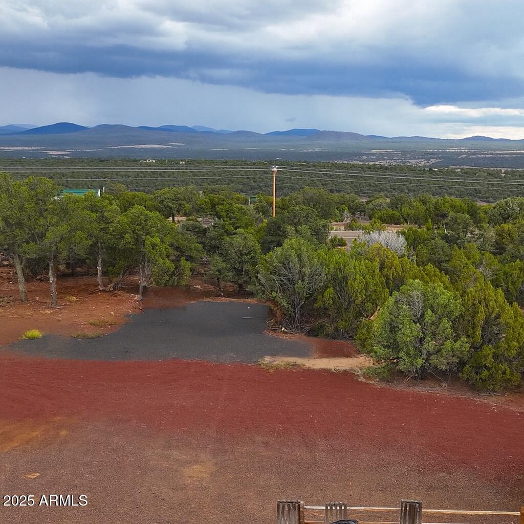 On/Off-Grid Paradise with Power & Septic Already Installed! This 2-acre parcel is the perfect blend of privacy and convenience. Just off the frontage road yet tucked away among tall trees with beautiful views. The land has been meticulously developed with trimmed pinyons and junipers, creating a peaceful, usable space that's ready for your vision. A house/RV pad are already in place, with power nearby and an impressive solar system that conveys with a strong offer. The solar setup includes a solar shed that doubles as a laundry/utility room, 3,000W panels, a 200-amp 48V 3 100 volt lithium batteries, w/ enough energy to conservatively power a three-bedroom home. In addition, the property comes with a 1,000-gallon septic system sized for 3 bedrooms. In addition, the property comes with a 1,000-gallon septic system sized for three bedrooms and a 3,000-gallon water holding tank for hauled or delivered water everything you need to get started is already here. All the hard work has been done for youbring your plans and create your dream retreat today!
