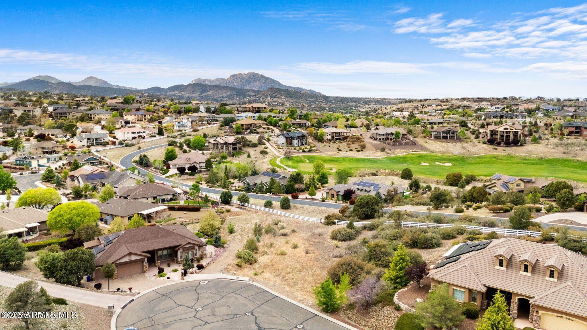 CUL-DE-SAC VIEW LOT! No HOA community of luxurious homes tucked away in the heart of Prescott. Surrounded by multimillion-dollar custom homes, this easy-build lot offers breathtaking views of Granite Mountain, framed by a gentle natural draw. It's absolutely stunning. Slightly elevated above the nearby golf course, it provides a beautiful green view of the 4th hole at Prescott Lakes Golf Club. Just 3.5 miles to the courthouse square, historic Whiskey Row, and local shops and restaurants. This is the last undeveloped lot in the cul-de-sac!