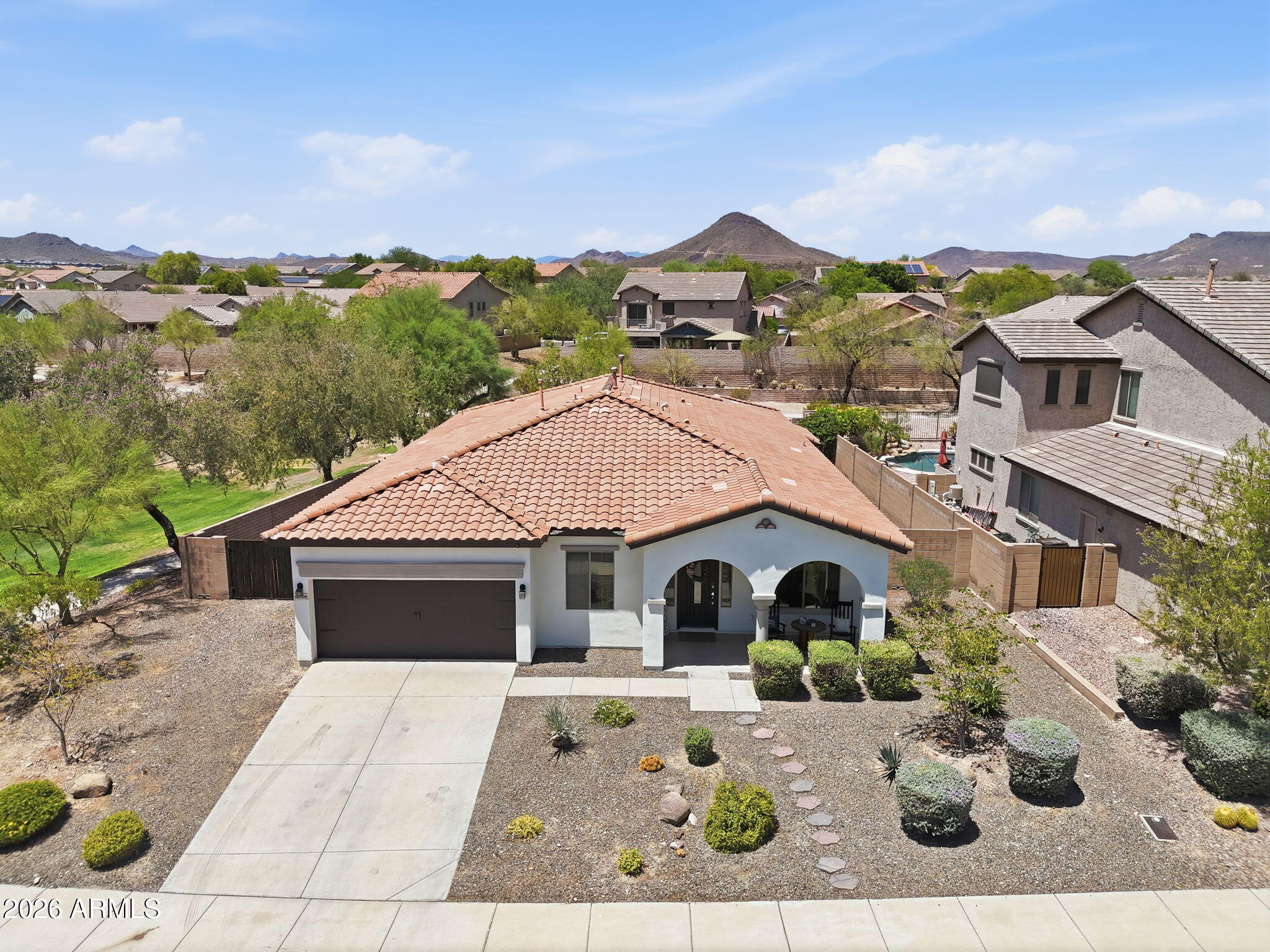 Welcome to your private Arizona retreat in the award-winning Vistancia master-planned community! This move-in-ready 4 bed, 2 bath home sits on a premium lot w/ a view fence overlooking a lush greenbelt w/ only 1 neighboring home.  Inside, you'll find updated tile flooring throughout the living areas & kitchen, plus new carpet in all bedrooms. The open-concept floor plan features a stunning 3-panel super slider, creating seamless indoor/outdoor living. Step outside to your backyard oasis complete W/ a sparkling pool & relaxing spa. Residents enjoy access to resort-style rec centers, community pools, pickleball & tennis courts, parks, trails, top-rated schools & more. Experience the lifestyle that makes Vistancia Arizona's #1 rated master-planned community in Arizona!