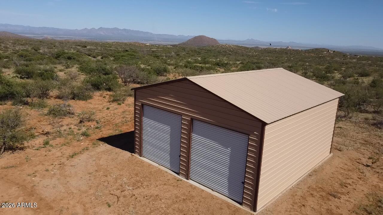 42.86 acres in High Lonesome Ranches with an amazing metal building awaits your custom home! Large view lot with amenities such as a private well and power pedestal on property. Well has been dug but no pump or electricity, power less than 100 yards away to the building and well site. This is the dream home starter kit you've been waiting for! Come bring your horses and toys to this amazing area boasting of some of Cochise county's most interesting history.  Close to Historic Tombstone and Gleeson jail, this property has a lot of useable areas for a large home, horse corrals and much more. Explore the high desert just minutes from this property.