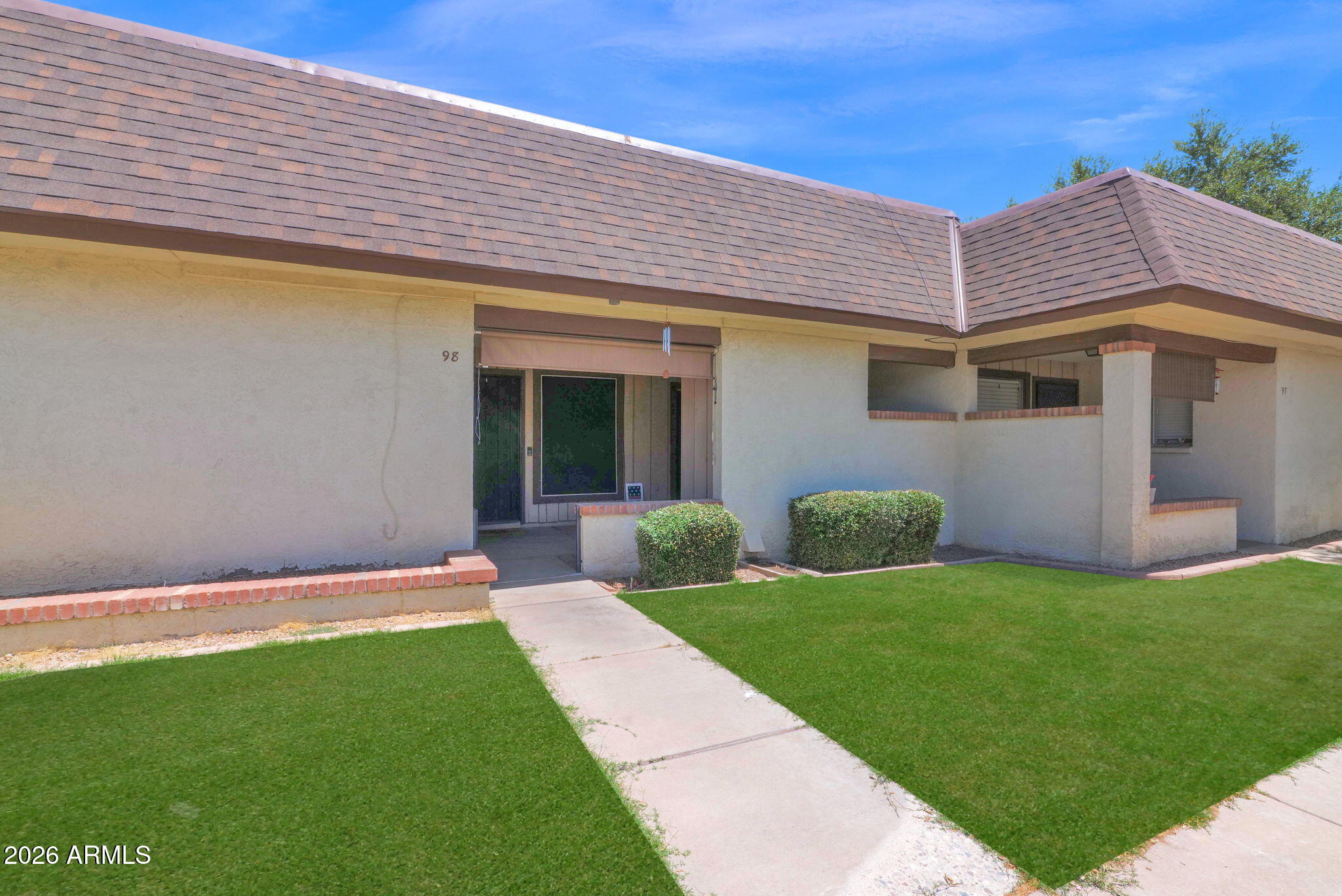 8161 N 107TH AVE 98, Peoria, AZ 85345 - great value in COUNTRY MEADOWS TOWNHOUSES, new AC in 2022! Wall to wall tile, granite countertops, stainless steel appliances, split bedrooms with each having private bathrooms, inside laundry, nice entry covered porch with storage closet. Recent roof replacement by HOA and HOA covers water, sewer, trash, pest control & common area maintenance. Covered parking and close to freeways, restaurants and shopping. You will not find a better package at this pric point.