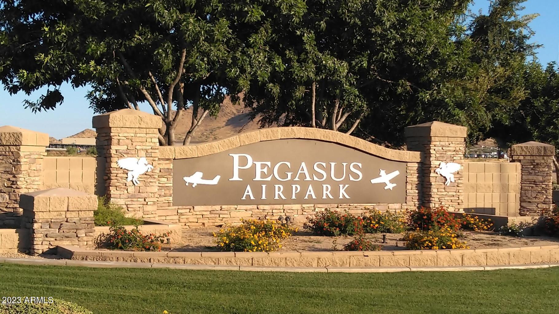 Welcome to your dream oasis! This stunning 3-bedroom, 2.5-bathroom home, nestled in Arizona's highly desired aviation neighborhood, Pegasus airpark, offers a perfect blend of luxury and functionality. Inside the 52' x 52' hangar you can park your aircraft with space to fit all of your toys! Step inside the home to be captivated by the meticulous attention to detail and premium features that define this residence, including an office with views of the San Tan mountains, a theatre room, a gourmet kitchen and a resort style owners suite with a private workout room, Outside into your private oasis - the backyard is an entertainer's paradise. Enjoy a game of pickleball on your private court, relax in the above-ground spa, or cool off in the pool. You won't want to miss this incredible home!