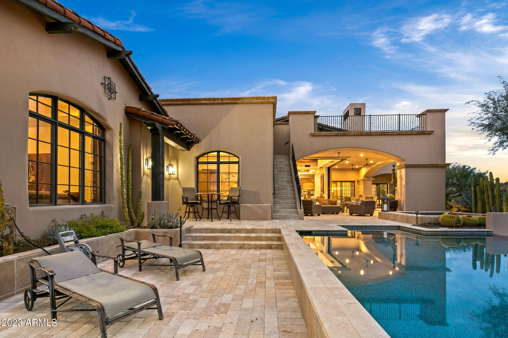 A Full Golf Membership is available to transfer with club approval. This recently updated home has all of the space, views, and quality you would expect of a home of this caliber. The new lighting through the home brings a more contemporary and lighter look to the interior space. The great room flows into the the outdoor space through the fully concealed motorized sliding doors. Enjoy the outdoor fireplace from both the indoor and outdoor spaces. The chefs kitchen features a huge island with seating and storage space, walk-in pantry, luxury appliances, and new counter tops and backsplash. The split floor plan features two ensuite bedrooms and full attached casita far away from the luxurious full remodeled primary suite. Enjoy the spacious glass shower and soaking tub, two water closets an and extra large closet space. The home office has plenty of natural light with ample space for storage and office equipment.  The formal dining room has double doors that welcome the warm ambiance from the fireplace and patio. The full wine cellar is conveniently located adjacent to the dining room. There is plenty of space for 3 cars plus your golf cart. There is plenty of built in storage plus a large storage room. Full valley views can be enjoyed from the observation deck accessed from the patio.