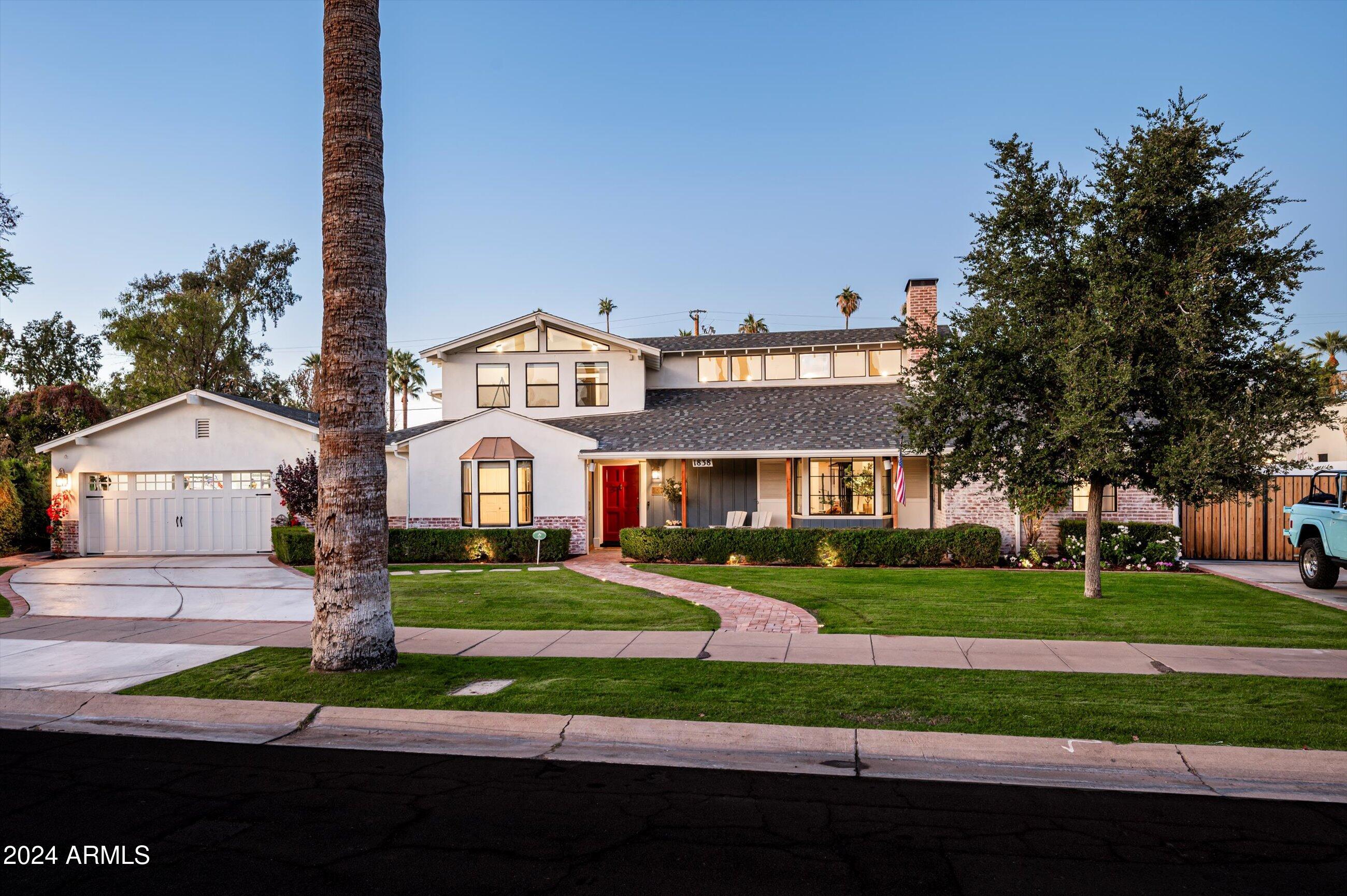 Nestled in the heart of the prestigious Encanto/Palmcroft Historic District, this stunning 1937 home is a masterful blend of timeless charm and contemporary luxury. With a 2018 complete rebuild that honors its historic roots, this 5,200-square-foot residence sits on over 1/3 acre of beautifully landscaped grounds. Offering 5 bedrooms and 4.5 baths in the main house, plus an amazing full guest house/entertaining pavilion, this is truly one of the finest homes ever to hit the market in Encanto/Palmcroft. Enter through the classic foyer to the heart of the home- the stunning open kitchen, featuring a massive center island, built-in banquette, and top-of-the-line appliances. Stacking glass doors open the main living areas to a private patio, seamlessly blending the indoor and outdoor living. The butler's pantry with a built-in beverage refrigerator and separate walk-in pantry both offer additional storage and prep space, making this a perfect home for intimate family time or for hosting large gatherings. 

The primary suite is truly a private retreat, with its own fireplace, a beautiful bath, sitting room/sun room with French doors to the private pool and yard, and a charming gallery space. 

A separate dedicated exercise studio offers a private space for workouts, yoga, or spin. The home has an attached 2 car garage plus another gated one-car covered parking area, a workshop and gardening area.

Situated on one of the palm-lined circles in one of Phoenix's most desirable neighborhoods, this home offers a fantastic lifestyle with exceptional design, history and charm