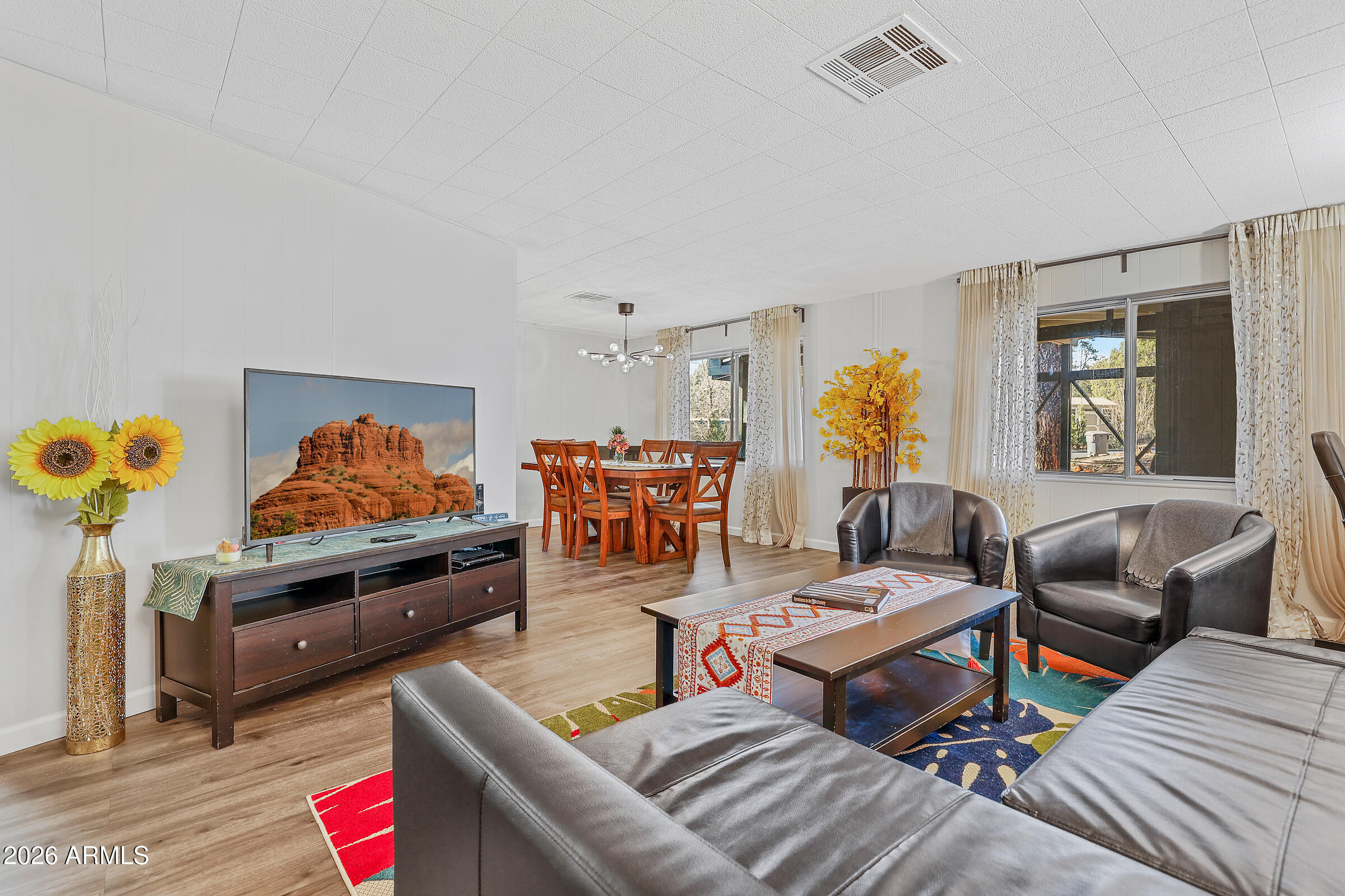 PUBLIC PREVIEW May 4th & May 5th 2:00 PM-5:00 PM. Financing available. No HOA. STR eligible. 

Where red rock views meet effortless Sedona living, this West Sedona retreat sits on a generous 0.25 acre corner lot with peek-a-boo glimpses of iconic Thunder Mountain. The 2-bedroom, 2-bath home draws you in through a covered deck entry into a warm, open living and dining space. A fully enclosed Sedona room invites you to linger in the high desert glow year-round. Remodeled top to bottom in 2021 with fresh finishes, updated appliances, new roof. Just added a brand new washer, gas dryer, and HVAC for you to simply move in. Tucked in the backyard, a charming detached studio mirrors the main home, ideal as a creative sanctuary or an efficient office. This home delivers it all.