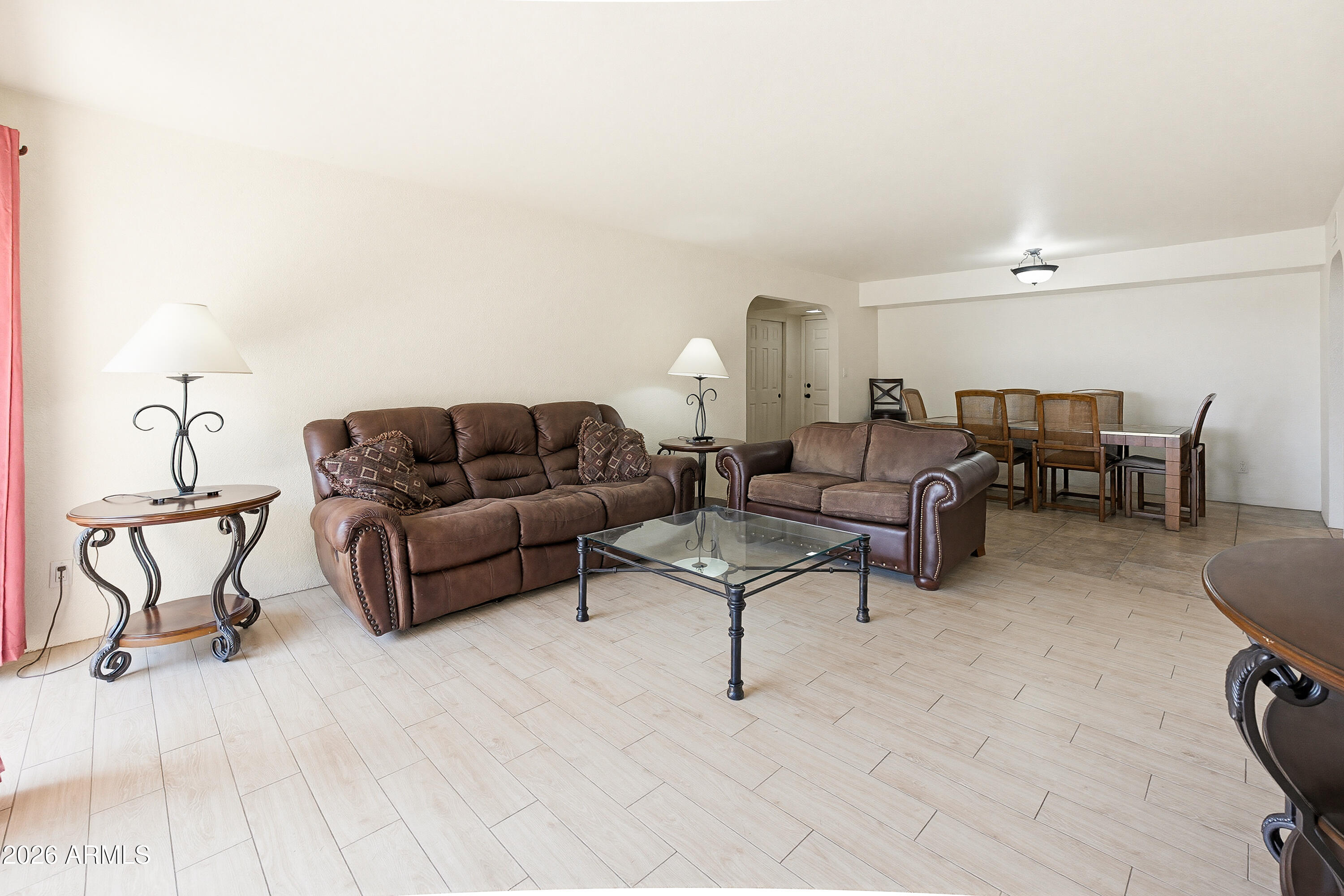 PRIME SCOTTSDALE LIVING in this UPGRADED GROUND-FLOOR unit with a smart SPLIT floor plan & expansive open living space. STORAGE is exceptional with dual closets in both bedrooms, including walk-ins. The kitchen is BEAUTIFUL with granite countertops, generous prep space, and clean finishes, flowing seamlessly into the living area. ALL TILE FLOORING-NO CARPET!  In-unit stackable washer/dryer. Optional furnishings available for a true turnkey setup. Large back patio for the plant lover! RESORT-STYLE community amenities include heated pool & spa, fitness center, BBQ areas and beautifully maintained grounds. Unbeatable location minutes to Old Town Scottsdale, dining, shopping, and Loop 101. 10 minutes to the airport & Salt River Fields, 25 minutes to Downtown Phoenix. Enjoy a turnkey Lifestyle!
