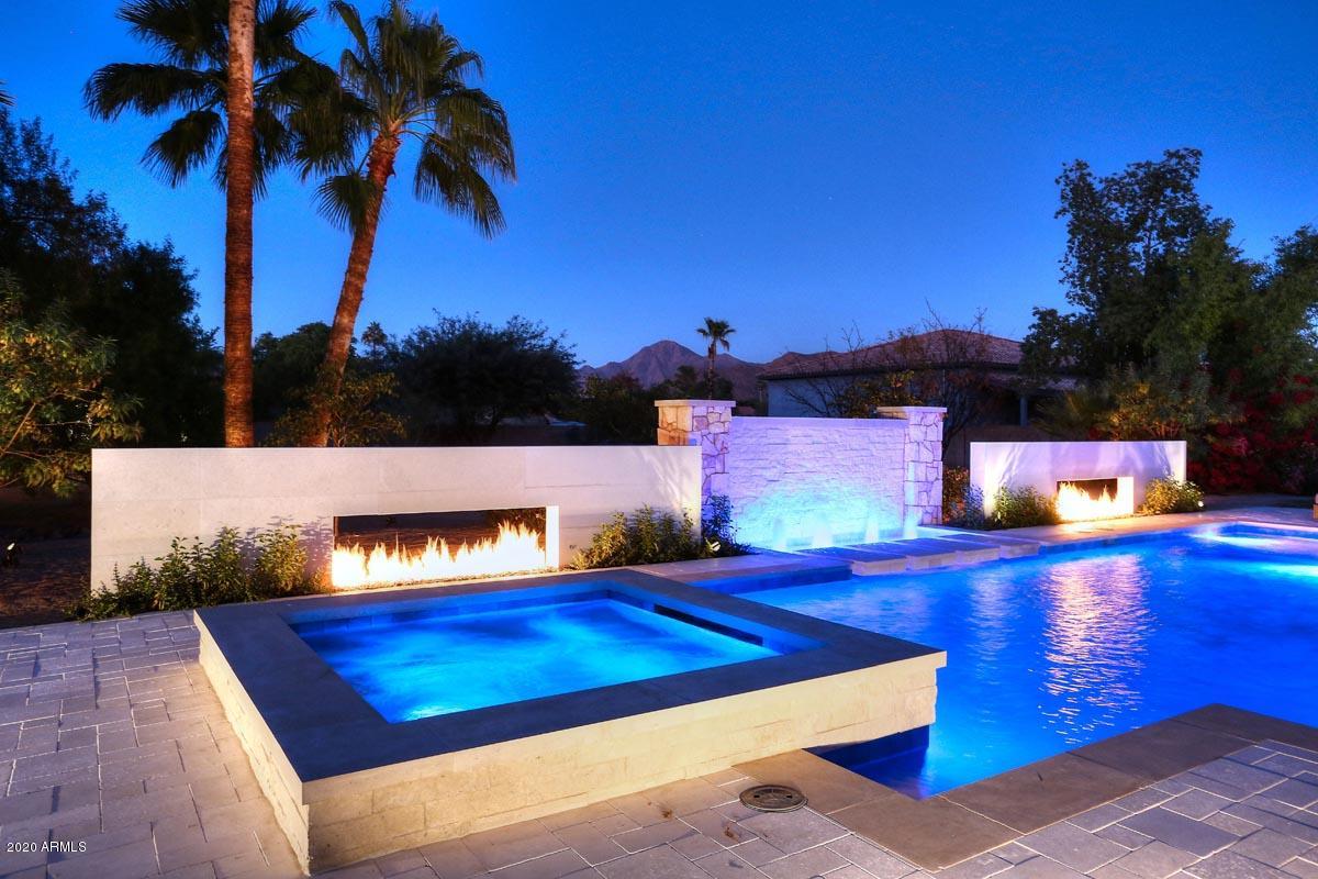 Main House: A timeless ''Transitional European Limestone Palace''.  Backyard: A park like setting with a new pool and spa that is a candidate for the NSPI Design award for the United States. Guest House:  An authentic ''Modern Farm House''. Enter through the new electronic gate onto the circular drive which incorporates authentic light gray ''Basalt Limestone Pavers''. The main entry of the home has three handcrafted limestone water features. The massive barrel ceiling in the entry way will take your breath away due to the detail of craftsmanship. Architectural Stone Elements deserves all the credit with their attention to detail for all of their handcrafted limestone designs. The main house has four bedrooms and five bathrooms. The master bedroom has his and her master bathrooms. Separate suite with outdoor patio on opposite wing of home. Office with gas fireplace is large enough for 2-3 individuals. A custom 210 bottle refrigerated wine closet is the focal point of the formal dining room. The custom temperature controlled wine closet, with LED lighting, can also be viewed from the spacious great room that features a massive hand carved limestone gas fireplace. This home also features a "One of a Kind" chef's kitchen with a massive island. All Wolf Appliances! The new Wolf 48 inch dual fuel range was just installed! The home has true custom cabinetry throughout. Extensive use of natural distressed brick in main house and guesthouse. The backyard is truly amazing! The new pool/spa and entertainment area are one of a kind! Walk over the Basalt limestone bridge of this park like backyard to the most incredible guest house I have ever seen! The guest house is a split floor plan with three bedrooms and two bathrooms. The guest house is a true "Modern Farm House". It has a full size laundry room. All appliances in the guest house have never been used. As per site plan, the property is exactly 1.253 acres. Like Luxury Homes DBA Like Renovation is a "Design Company". Like Luxury Homes has built homes from $2M to $8.2M. Like Renovation has redesigned 34 homes within the past seven years. All of the details of this redesign are unique and the applications of the materials are unique to the main house, the backyard and the guest house. I promise that this home will amaze you and it is a true timeless transitional masterpiece! Click on ''Document Icon'' to view site plan for main house and guest house without new pool/spa