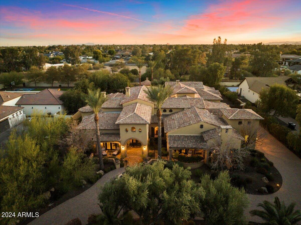 Experience the essence of Arizona luxury in this carefully crafted single-level Spanish
Revival-style residence. Handpicked rooms feature stunning barrel brick flooring and
ceilings, infusing an air of sophistication. Each bedroom is designed as an ensuite for
added privacy. Meticulous attention to detail permeates the entire space, fostering a
seamless flow between areas. The primary suite boasts dual entry to the shower,
closets, and toilets, ensuring elevated comfort. Venture beyond the interiors to discover a
backyard tailored for entertainment with its spacious layout, heated saltwater pool, and
freshly laid turf. This residence is truly a must-see, showcasing a harmonious blend of
luxury and craftsmanship in the heart of AZ- every aspect radiates quality. See Motion VIDEO!