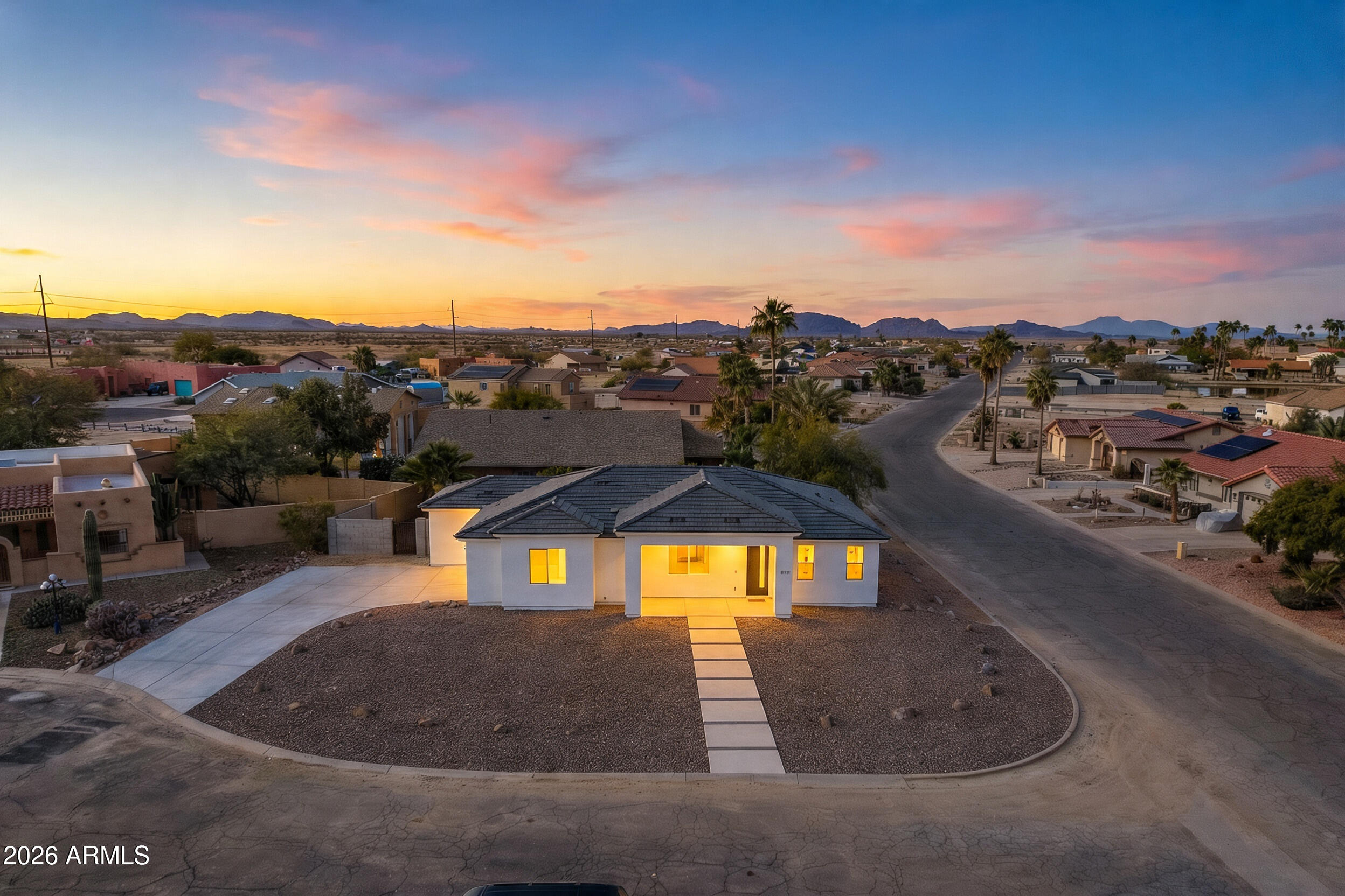 MODERN design meets PEACEFUL Arizona living! This SPACIOUS NEW BUILD not only qualifies for $0 DOWN but also features a bright OPEN LAYOUT with contemporary finishes and thoughtful details throughout.

Step inside to find WOOD LIKE TILE throughout, GRANITE countertops with a tasteful BACKSPLASH, a LARGE ISLAND, and a walk-in pantry, perfect for everyday living or entertaining guests. The split floor plan features a LARGE primary suite with DOUBLE vanity sinks and updated with TILE GLASS SHOWER and ELEGANT Light Fixtures! Situated on a CORNER LOT in a quiet CUL DE SAC, this home offers beautiful lake and mountain views, an 8,051 sq ft lot, block fencing for privacy with short PALM TREES, and a 2-car garage with additional parking. Within Minutes of Golfing, Dining, and Adventures from Hiking, Canoeing, or Biking!