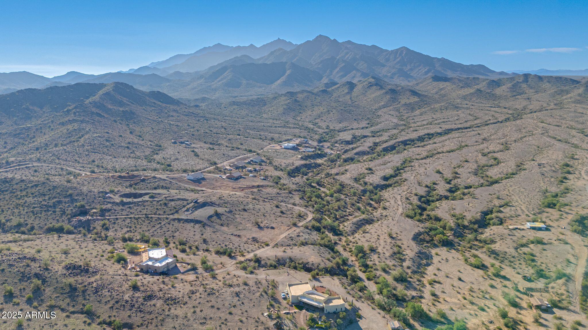 Incredible opportunity to own 1.364 acres of vacant land with 360-degree mountain views located on an unincorporated county island at the base of the Estrella Mountains. Enjoy a peaceful rural setting with easy access to Goodyear, Avondale, and Phoenix amenities.
This unique property offers the perfect balance of privacy and convenience—just minutes from spring training facilities, Phoenix Raceway, and the scenic Tres Rios Wetlands, known for its hiking, horseback riding, kayaking, and fishing.
NO HOA and plenty of space to build your custom home, horse property, or outdoor retreat. Whether you're looking to invest, build, or simply escape the city, this land offers endless possibilities and unbeatable mountain views. Bring your house plans and make your dream a reality! Owner Agent