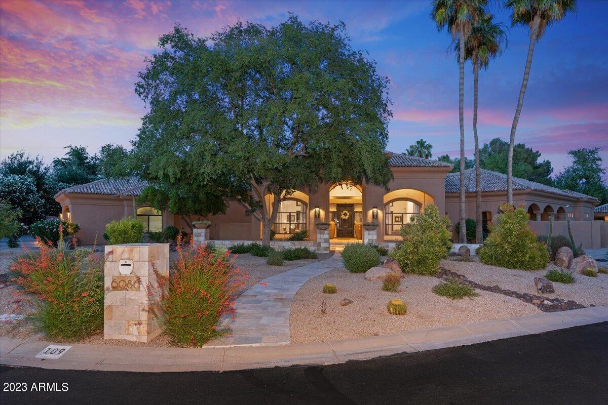 This luxurious estate has multiple updated amenities and features. Dramatic entry to this posh split floor plan boasts privacy with an office, gym and owners suite. The tranquil owners suite has a wet bar, floating cabinetry, modern finishes and stone surrounds leaving you feeling like you're in a high end spa. The opposite side of the house has a beautiful modern kitchen which includes automatic open and close high gloss cabinets, high end stainless steel appliances, butlers pantry with sink, beverage fridge and an abundance of storage.  There is additionally a bedroom wing with three bedrooms and three baths with a generous living space in the middle for study desks, tv gaming area for children or guests equipped with a wet bar and additional fridge drawers. Completely disappearing... pocket doors are exquisite for entertaining, opening to a captivating backyard showcasing a dreamy pool with fountains, spa, expansive patio, impressive sports/basketball court and putting green. Impeccable touches to note are the walk in wine cellar, 1 bedroom detached casita with bath and the low maintenance turf.