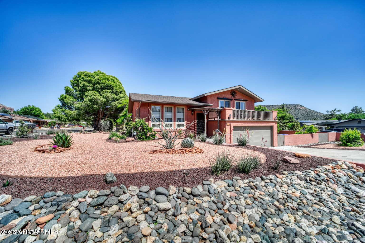 PRICE REDUCED! SELLER MOTIVATED! This beautifully updated home is move-in ready and boasts stunning views of Bell Rock, Castle Rock, and Courthouse Butte. The spacious main floor flows into the dining area. The master bedroom features a private deck, perfect for soaking in the breathtaking red rock landscape or enjoying the night sky. The kitchen has been tastefully remodeled, complete with a center island, soft-closing cabinets, and essential appliances like a dishwasher, stove, and refrigerator. Additionally, the home is fitted with stylish sun-protective window treatments, including plantation shutters, retractable shades, and blackout curtains in the master bedroom, ensuring both elegance and comfort while providing ample storage options