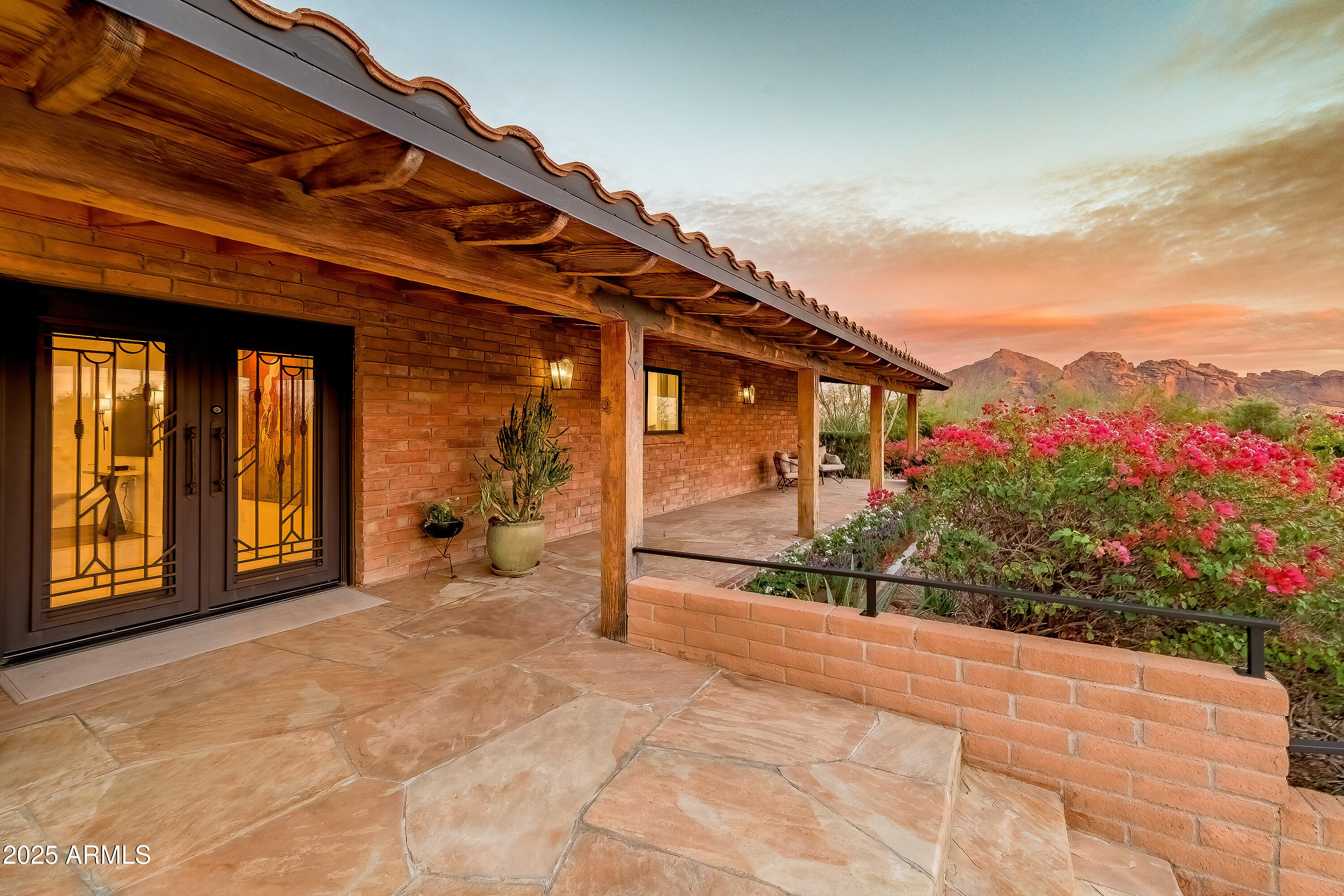 Professionally designed remodel in 2024 by H.Ryan Studio where modern meets art deco influence. Enjoy gorgeous sunset views of 3 mountains including Camelback and Mummy Mtn! Over $640,000 in high-end finishes including Thermador appliances with 48in Pro Range w/ Steam, French Oak Flooring and 12x24 limestone tiles throughout. The great room is designed around a custom banquet & waterfall bar area that will exceed all 'cool' expectations! You'll also have a true 'Owners Suite' with its own sitting area, custom closet & spacious bath. Living options are plentiful with a home gym (could act as 3rd bd), glass walled office and a separate den which make your new home super livable for the AZ lifestyle. First Loan is assumable at 2.25% making your payments far lower than current rates! Also including an expansive backyard w/a covered patio, extended paver seating area & walkways, a built-in BBQ, fire pit, and a sparkling blue pool w/a stone waterfall, this home is a dream come true! Act now before it's gone!