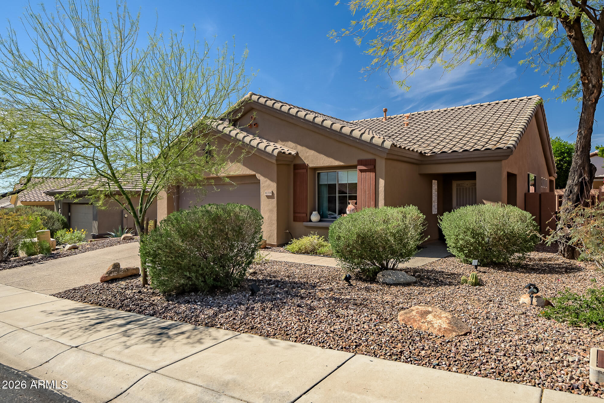 Located in prestigious Anthem Country Club, this beautifully updated home blends modern style with peace of mind. The circular kitchen wall was removed to create an open, flowing layout perfect for entertaining. Enjoy an extended patio with built-in gas grill, new flooring throughout, and drapes and shades in every room. Major upgrades include new HVAC (6/2025), LG washer & dryer (6/2025), kitchen appliances (2025), water heater (2024), faucet & disposal (1/2026), Genie opener, roof repairs (2020), plus interior (2020) and exterior paint (2023). Move-in ready and beautifully maintained!