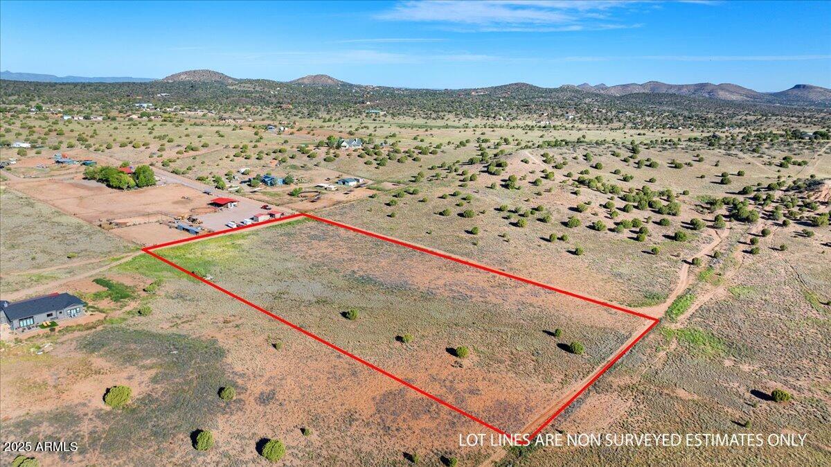 Welcome to 4055 W Covey Ridge Lane, a serene 5 acre parcel located in the desirable Williamson Valley Heights subdivision of Prescott, Arizona. This expansive property offers panoramic views of Granite Mountain, the Bradshaw Mountains, and the surrounding high desert landscape. Gently sloping terrain with a mix of grass, juniper, and pinon trees provides a beautiful setting for building your dream home while enjoying privacy and seclusion. With state land bordering directly to the east, you'll experience wide open views and endless skies while still being within a reasonable drive of both Prescott and Chino Valley.

This property is zoned for site built homes only with a minimum of 1500 square feet, giving you the freedom to design a custom residence that perfectly fits your vision. Utilities include electricity nearby, propane, and telephone service, while a private well will be needed. Producing wells on surrounding parcels show excellent potential for water access. With no HOA, you'll enjoy flexibility and freedom without added restrictions.

Whether you are planning a family homestead, a horse property, or a peaceful retreat, this land is well suited for multiple uses. Horses, farm animals, and domestic pets are welcome, making it ideal for those seeking a rural lifestyle. Located at the end of a private maintained road, this parcel combines quiet country living with convenience to town amenities.

Come walk this stunning 5 acre property, breathe in the fresh mountain air, and picture your future home against the backdrop of Arizona's breathtaking high country landscape