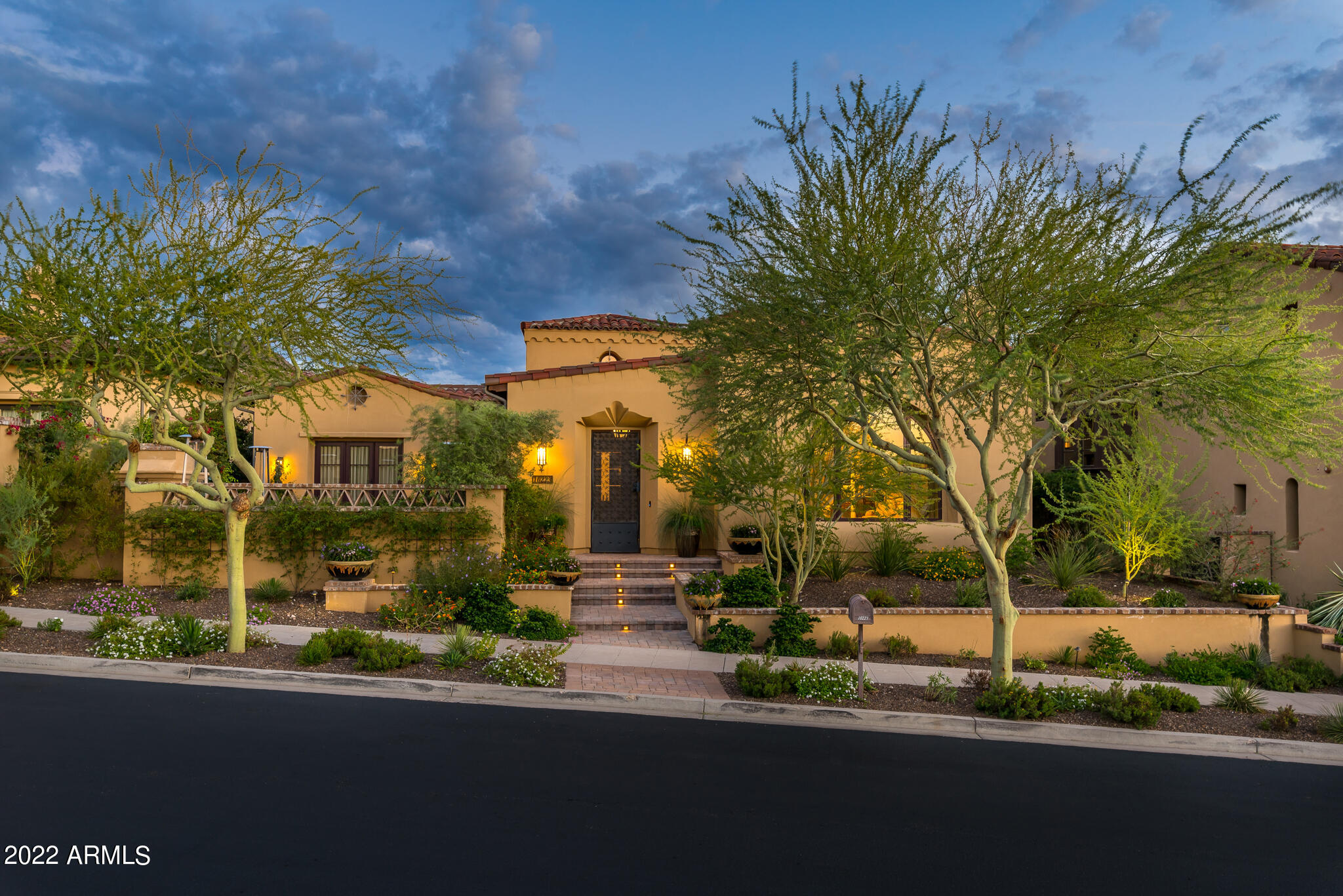 Located on a premium lot adjacent to a natural preserve in the prestigious and highly desirable neighborhood of Horseshoe Canyon and is within walking distance to the Silverleaf Clubhouse. This extraordinary Camelot built home with popular floorplan lives on the first floor where every square inch is flanked with charm.  As you walk through the front entrance, you are greeted by its inviting courtyard that features an outdoor fireplace and incredible views. Inside, enjoy the open space floorplan and impeccable attention to detail throughout. This home is immaculate in every way from the highest quality custom finishes, vaulted ceilings, beautiful hardwood flooring, media room, 800 bottle climate controlled wine room, gourmet chef's kitchen with stainless steel appliances, custom cabinetry and lighting. The generous master retreat includes a sitting area, stunning bath, and a spacious walk-in closet with beautiful custom cabinetry.  Low maintenance living in Silverleaf is yours with this remarkable home.