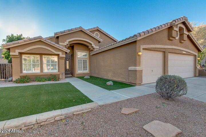 Single story located on an excellent private hillside lot in Crimson Canyon. Four bedroom/two bath home just newly painted inside and new carpet in the bedrooms.  Easy care travertine flooring as well as plantation shutters. Vaulted ceilings make this house feel larger than the square footage.  Granite countertops, refinished cabinets, fireplace, and surround sound, This preserve lot with an extended covered patio, travertine decking, and artificial turf is a fantastic entertainment venue!  Pebble tec pool with newer pump and crawler cleaner. Artific1al turf in front yard as well for easy care.  Three car garage with epoxy floor, cabinets and man door.  Newer water heater plus a water softener.  Excellent location to Sky Harbor, the best restaurants, shopping and South Mountain trailheads for hiking and biking.  Easy access to the 202 freeway as well. The foothills are absolutely beautiful and living in them offers wonderful views and easy living!  Come see your next  home!