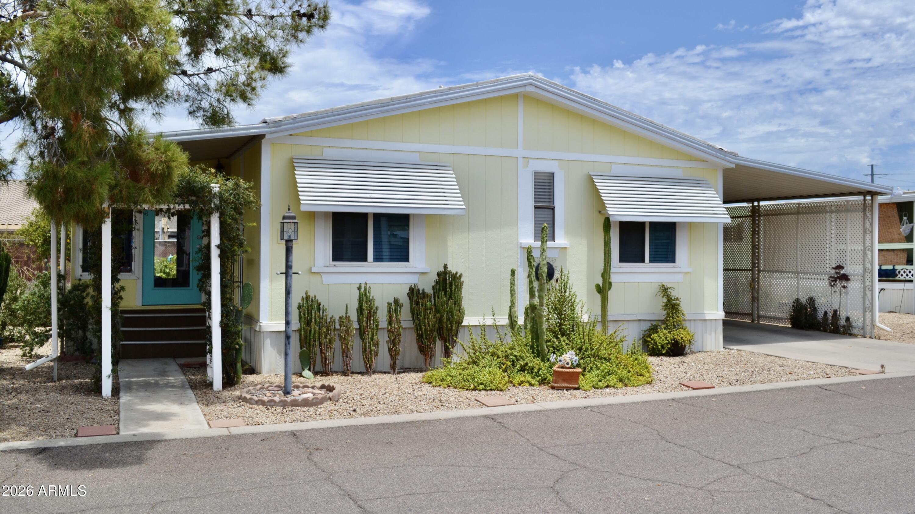 Beautifully updated and move-in ready home in the popular Desert Skies community! Enjoy luxury vinyl plank flooring (2018), a new heat pump (2022), and water heater (2025). The spacious kitchen features solid wood cabinetry, a built-in lighted china cabinet, desk area, and abundant storage. The bright Arizona room is fully integrated with the living area, creating an open, spacious feel (not included in square footage). All appliances, including the washer and dryer, convey. The beautifully landscaped front yard creates a warm welcome, while the oversized backyard features orange and fig trees, a greenhouse, storage shed, and a relaxing patio. Upgraded windows complete this exceptional home!
