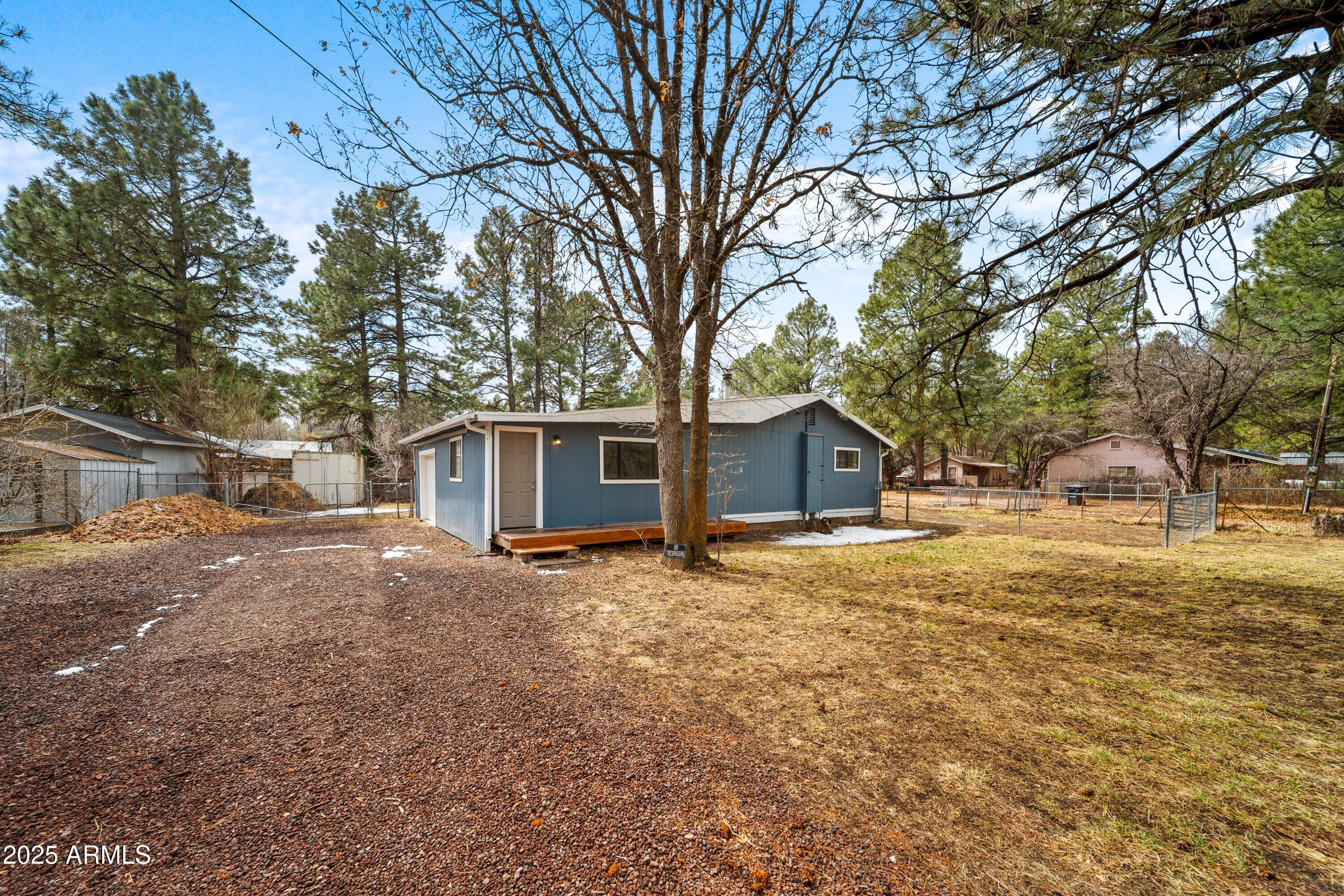 Nestled in the serene Lakeside neighborhood, this charming 2-bedroom, 2-bathroom home offers 1,100 sq ft of cozy living space on a generous 13,000 sq ft lot. Upon entry, the welcoming living area flows seamlessly into an updated kitchen, featuring sleek stainless steel appliances that cater to culinary enthusiasts. The owner's suite serves as a tranquil retreat with abundant natural light, complemented by a flexible additional bedroom ideal for guests or a home office. Outdoors, the expansive lot with tall pine trees invites endless possibilities for outdoor living.  An oversized one-car garage partially converted into a third bedroom/den adds versatility. Experience this home today. Investors wanted! Tenant in place until July 2026.