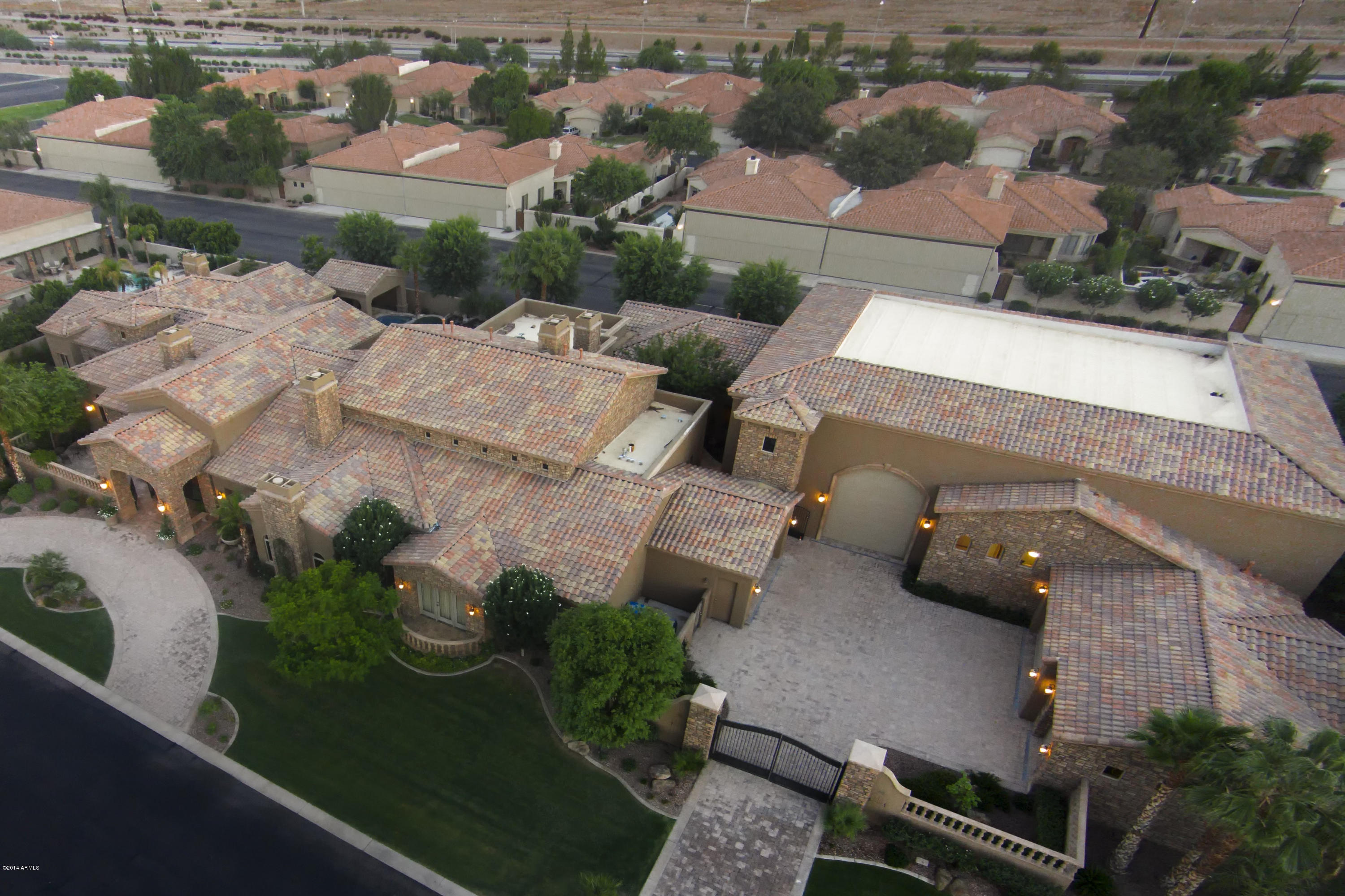 World Class Aviation Estate.  Luxury Living is Enhanced by the Exhilaration of Your Private,Massive On Site 5200+s/f Commercial-Style Airplane Hangar. 75'x 17' Schweiss Bi-Fold Door, Tiled Floors with 2500psi Rated Weight, A/C and RV Door Offers Storage for Private Aircraft, Helicopters or Prevost Motor Coach.
Unique Living Spaces: Stunning Family Room, English Hunt Room Clad in Mahogany, Morning Room, Lavish Master Suite, Exercise Studio, Walnut Office. Billiards/Poker Room, Full Bar & Theatre for 20 are Sensational for Entertaining. The Best in Home Audio, Video & Electronics. Fly-In Guests or Private Pilot(s) will Enjoy Top-Tier 2 Bedroom Guest Home. Resort Backyard with Heated Pools,Spa, Outdoor Kitchen.5-Car Garage & Gated Motor Court. One-of-A-Kind, First Class.  SEE VIDEO