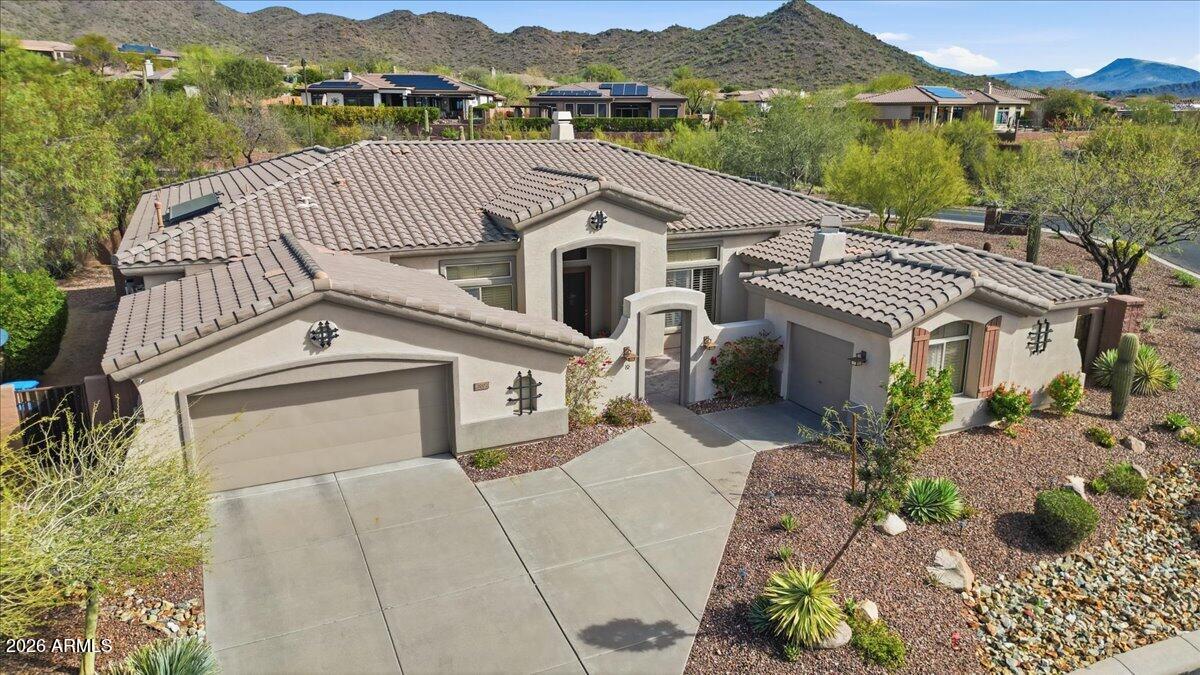 Nestled on a corner oversized lot in the exclusive, gated Anthem Country Club, this stunning 3BR/2.5BA home delivers the Arizona lifestyle at its finest. Soaring ceilings, a generous den/library, butler's pantry, and whole-home sound system sets the tone. Step out to your private resort: newly resurfaced heated saltwater pool and spa framed by breathtaking Daisy Mt. views - your own slice of paradise. Newly planted lush hedging creates a private retreat. The 3 car garage features an insulated, A/C bay perfect for a shop, golf simulator or studio. Fresh int. paint, new A/C units with extend warranty, plus new water softener and RO system mean you're truly move-in ready. World-class amenities: two championship golf courses, clubhouses, fitness centers, tennis, and dining all with your gates.