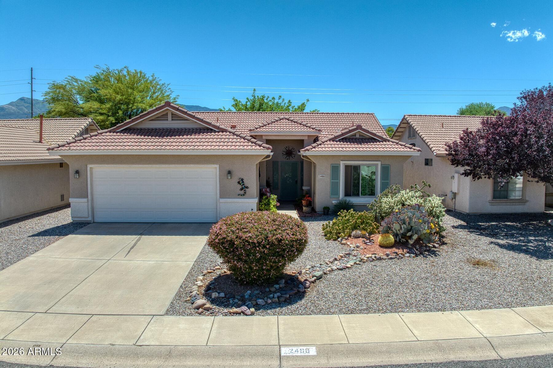 Here's a wonderful opportunity to own this great 2 bedroom 2 bath home with large great room, dining area, spacious kitchen along with small office space and a 2 car garage.  This well cared for home has all new windows, newer LVP flooring, ceiling fans and lights, newer appliances, new toilets, new water heater, and new interior and exterior paint.  There's a nice covered patio out back along with a landscaped yard.  The security door on the front is great to allow the cool air to come in with security.  You also have the ability to use both clubhouses and swimming pools in this age restricted, gated community.  Seller installing NEW HVAC system week of June 22nd.