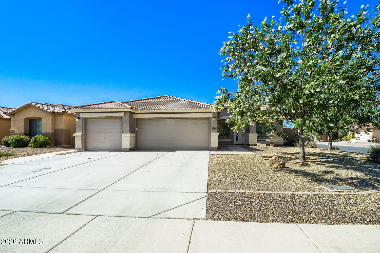 MOVE IN READY - SPOTLESS - Gorgeous, thoughtfully remodeled 3-bedroom, 2-bath home with a 3-car garage, situated on a desirable corner lot with RV gate access from the side street. North/ South Exposure. This exceptional property offers extensive upgrades, abundant storage, and a highly functional floor plan that is sure to impress. Remodel w meticulous eye for detail and craftsmanship. Originally designed as a 4-bedroom home, the fourth bedroom has been professionally converted into a spacious laundry and flex room featuring upper and lower cabinetry, a utility sink, and ample space for a hobby room, craft area, or home office. The washer and dryer are included.
The beautifully remodeled kitchen features custom cabinetry, a large quartz island, electric cook-top, stylish pot filler, built in oven and microwave, walk in pantry with built in spice rack, desk area, and an inviting breakfast nook with a charming bay window. The open-concept living space is perfect for entertaining and includes an electric fireplace and mounted television, both of which convey with the home. The adjoining family room showcases a stylish beverage center tucked behind pocket folding doors, complete with a beverage refrigerator, tile backsplash, countertop workspace, and upper and lower cabinetry.
The spacious primary suite offers a fully remodeled bathroom with dual vanities and a walk-in shower featuring sliding glass doors. The guest bathroom has also been tastefully updated.
Additional improvements include:
" Wood-look plank tile flooring throughout main living areas (2022) 
" Brand-new bedroom carpet (2026) 
" New HVAC system (2024) 
" Remodeled kitchen and bathrooms (2021)
" Breakfast nook addition with bay window (2020)
" Laundry / craft /office room reconfiguration (2020)
Storage is abundant throughout the home. Ask me about the clever secret storage area! The former laundry area off the garage has been reconfigured to include an upright freezer (included), a large storage closet for cleaning supplies, a coat closet, and an additional linen closet.
Step outside to a low-maintenance backyard featuring separate "his and hers" sheds--one equipped with air conditioning and ideal for a hobby room, studio, or retreat, while the other is perfectly suited as a workshop. Covered Patio has 2 retractable roll down shades for extra comfort.  Additional features include an exterior service door from the garage to the side yard and shade screens on the windows for added energy efficiency.
This move-in ready home combines comfort, style, storage, and functionality in one impressive package. Water company is Epcor & Queen Creek. Home is all electric but does contain gas hookups should you want to convert back to a gas hot water heater. Buyer to verify all material facts and measurements.