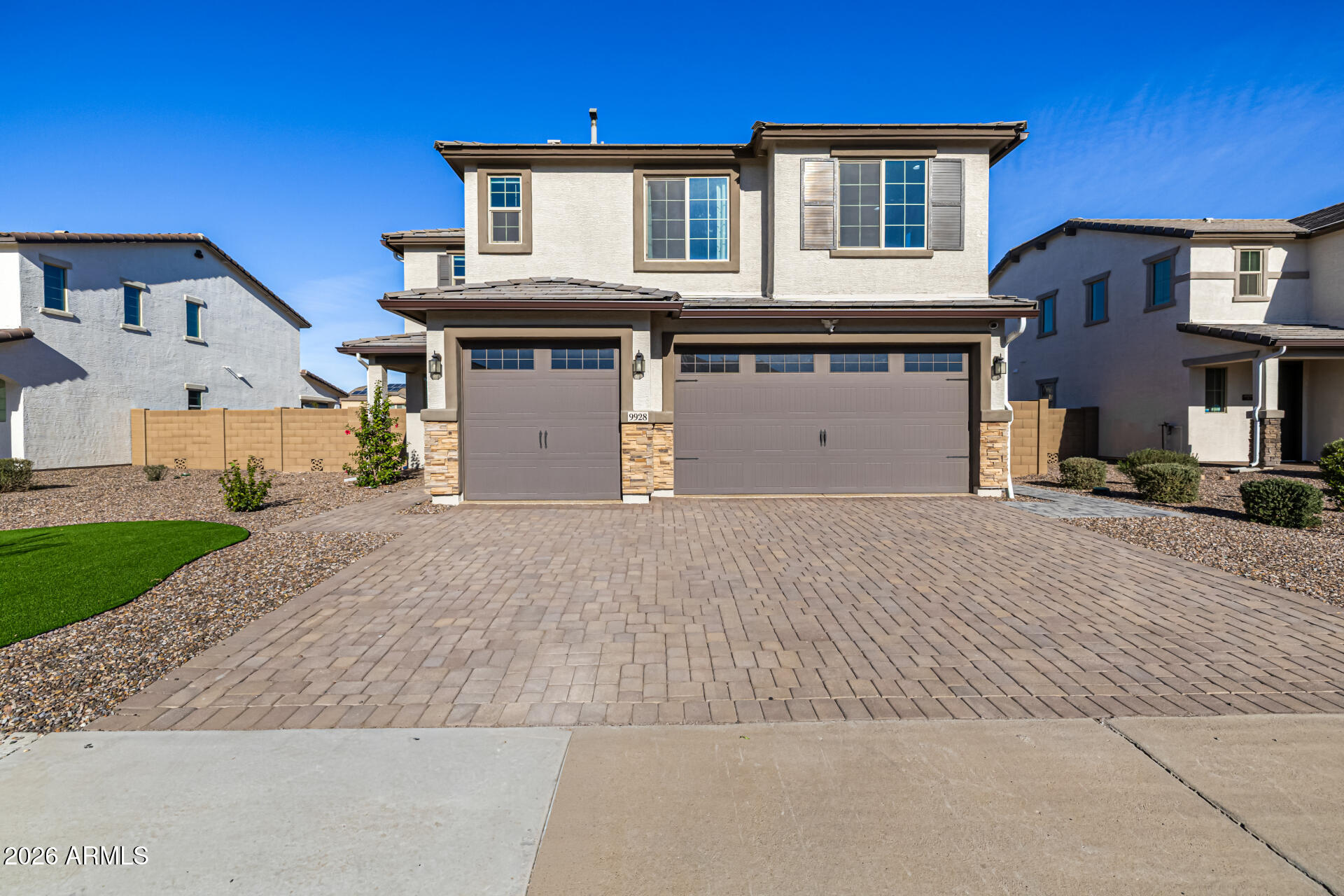 Your dream home is finally within reach! This gorgeous 5-bedroom home showcases a 3-car garage, beautiful stone accents, a stylish paver driveway, and a thoughtfully designed front landscape. Fall in love with the captivating great room with high ceilings, recessed lighting, and attractive wood-look flooring. The stunning chef's kitchen boasts quartz counters, crisp white shaker cabinets with crown moulding, chic pendant lighting, a tile backsplash, stainless steel appliances, a walk-in pantry, and an island with a breakfast bar for casual dining. Upstairs, you'll find a sizeable loft that provides a versatile living space. The primary bedroom boasts plush carpeting, an ensuite with double sinks, and a convenient walk-in closet for an organized wardrobe. Imagine enchanting evenings in the lovely backyard, showcasing a covered patio and pristine artificial turf for outdoor gatherings. Make this exquisite gem yours today!
