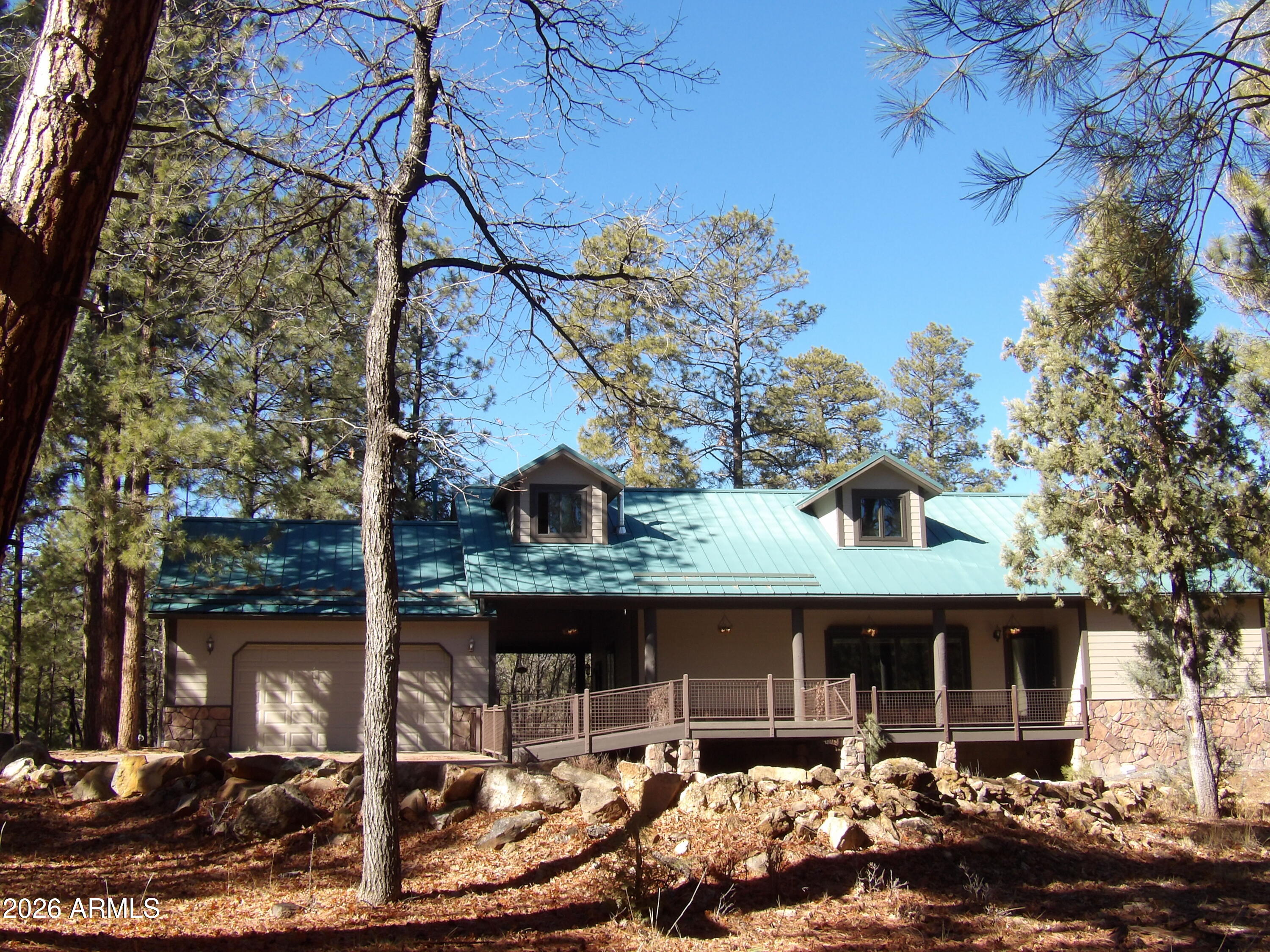 Majestic lodge in the tall pines on .847 acre. lot and Lot 193 are being sold together. Lot 193 is .843 acre. They sit at the back of a Cul de sac and border a common area of the community. Lots of privacy! This gorgeous 3 bdrm, 3 bath home has Aspen T&G ceilings in the copen concept Great Room. Enjoy the custom FP and many built ins. Spacious kitchen w/all the upgrades including custom Hickory cabinets, island & walk in Pantry. Upstairs is a large loft area w/bonus area, bedroom and office. Wonderful views from upstairs dormers. On the main floor is the master bdrm suite with en-suite bathroom. 2nd bedroom on the first floor for guests. Incredible covered and uncovered trex decking for entertaining. Covered breezeway to the heated garage and a separate storage room w/built in cabinets!