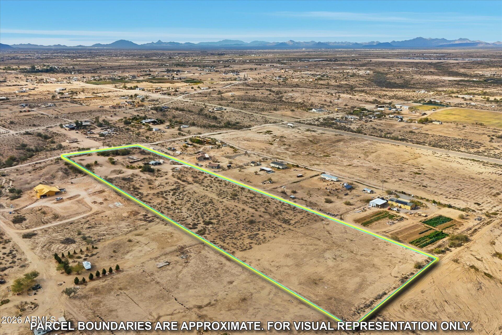 Beautiful citrus trees line the driveway of 10 acres of well groomed land that can be subdivided. 
Enjoy the wonderful views and sunsets and access to the Hassayampa River Recreation area and surrounding mountains.
 All new underground electric, NEW watering lines and a road that takes you past the steel shed that is lockable. Container does not convey.
 It has grandfathered water rights and  a well to supply all the property. The land is ready to be used as an orchard or a home for one or more families.  
A rare find in Tonopah, it sits on a bluff and is  the highest point in the area.. You must see to understand all the possibilities this could offer for investment or a wonderful place to live.
WIRED FOR R.V.
NO HOA