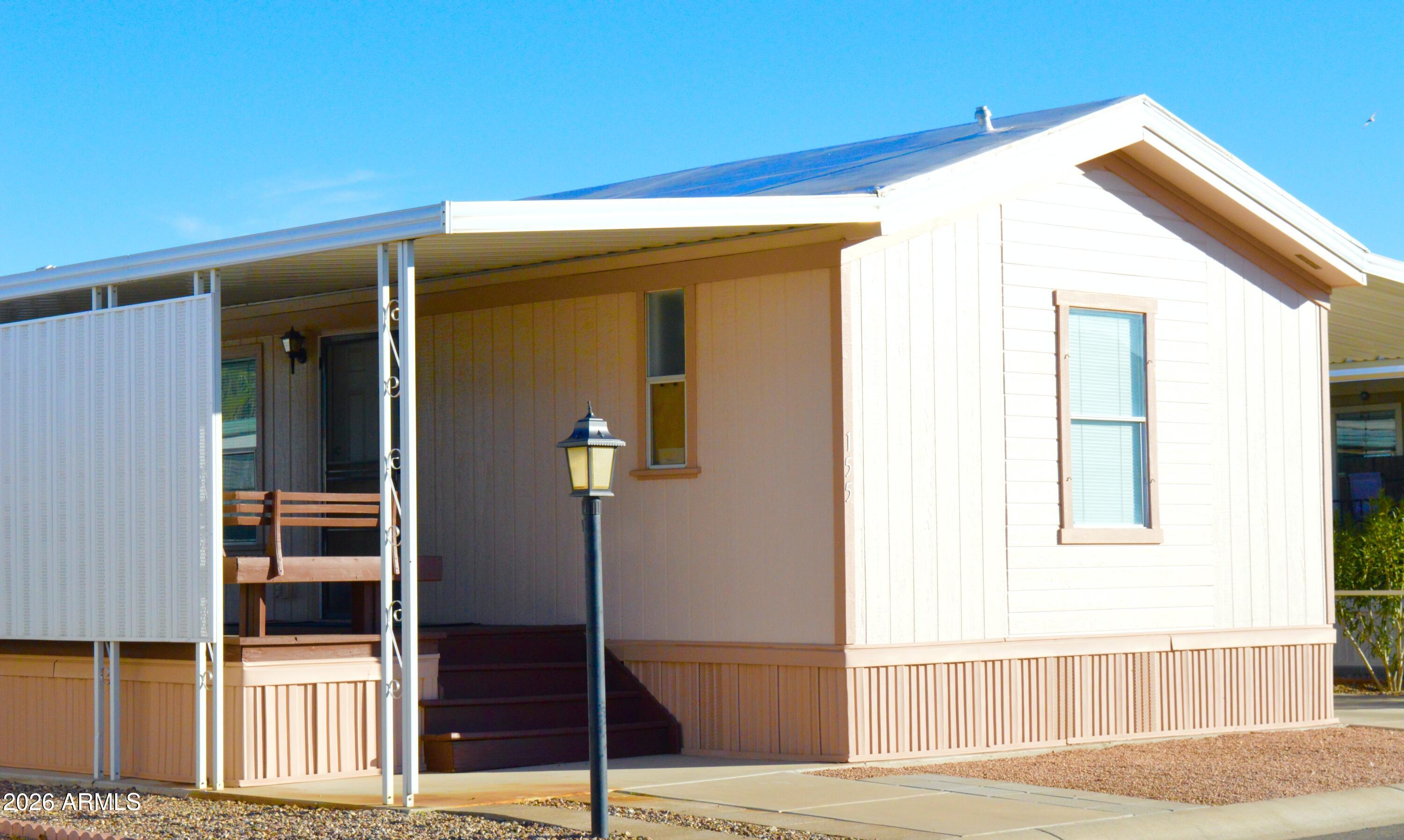 This spotlessly clean, 2 bedroom, 2 bath gem is tucked away in a desirable 55+ community in growing Casa Grande. It features a spacious open floor plan, an ample living room, dining area, & a kitchen with pantry & plenty of cabinets, all set in a soothing neutral color palette. The large master bedroom is ideal for a king size bed & it has a wall to wall closet, & a walk-in shower. The ample front & back decks are just the place for friendly gatherings. And  you get a nice, large, finished shed/workshop for all those tools and toys you just can't part with. For fencing, a row of oleanders graces the side of the carport for precious private moments. It can sell partially furnished or unfurnished.  Come by and see for yourself!  Owner is a licensed real estate agent in the state of Arizona.