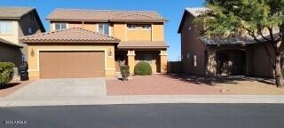 If you are looking for that rare 5 or 6 bedroom home, look no further, This lovely home has many upgrades including granite counters through out the baths and kitchen. There is a custom neutral paint scheme as well the flooring colors. There are 2 bedrooms downstairs with the rest upstairs. There is a full bath downstairs as well as 2 full baths upstairs. You will love the master suite. There is a balcony with a view of the walking path and open area behind the house as well as a view of the mountains. There are 2 closets including 1 walk in and 1 regular. The master bath has a shower and separate garden tub as well as dual sinks.   No Subject to offers or escalation clause offers will be entertained.