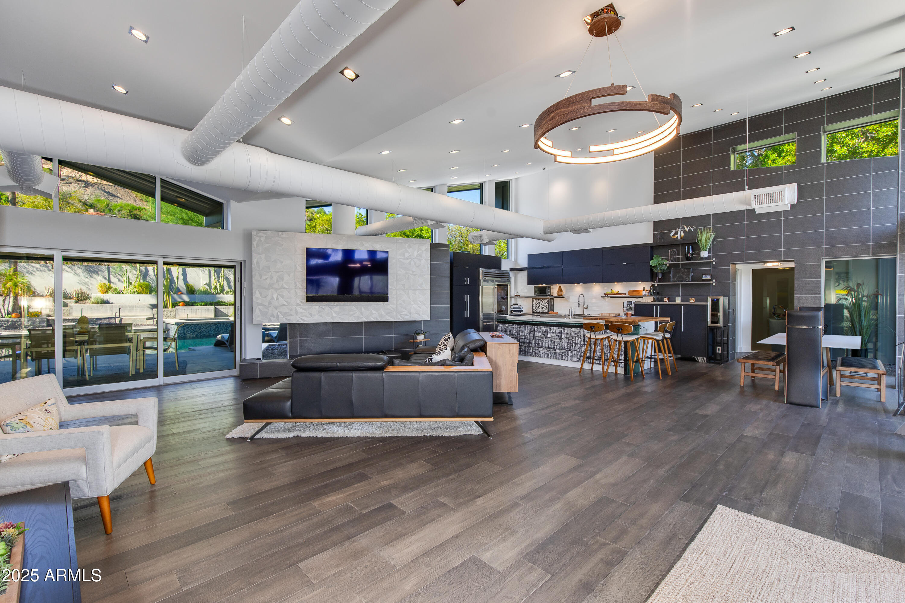 Thoughtful luxurious design awaits you around every corner in this Contemporary masterpiece.Immediately the uber private 1+ ACRE lot that has been meticulously cared for will catch your eye along with the unique custom craftsmanship. Step inside to the open floor plan with floor to ceiling glass
that lets in the perfect amount of natural light. The chefs kitchen and great room with gorgeous fire feature wall, exposed ducting and stunning vaulted ceilings are perfect for entertaining or just relaxing with the family. 12' pocket doors open to
the NEWLY RENOVATED RESORT STYLE backyard featuring a heated diving pool, built in BBQ area under a well designed pergola system and numerous other covered seating areas to take it all
in.(SEE ADDITONAL INFORMATION IN DOCUMENTS, TO MUCH TO LIST!!!)