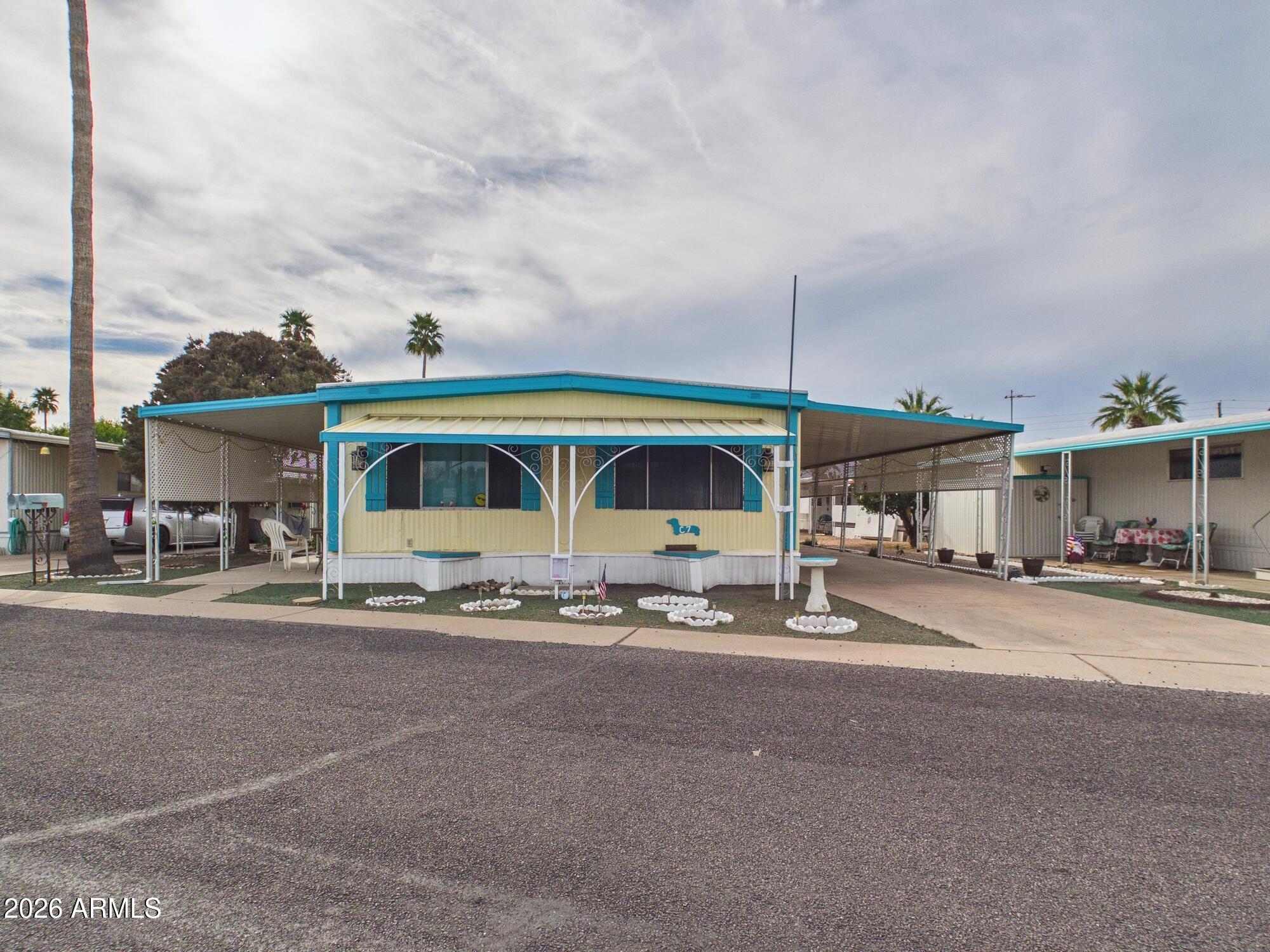 Welcome to this bright and inviting 2-bed, 2-bath manufactured home offering 1,056 sq. ft. of comfortable living space in a peaceful 55+ community in Mesa. This well-maintained doublewide features a sunny interior, spacious kitchen with ample storage. Ideal for year-round residence or seasonal retreat