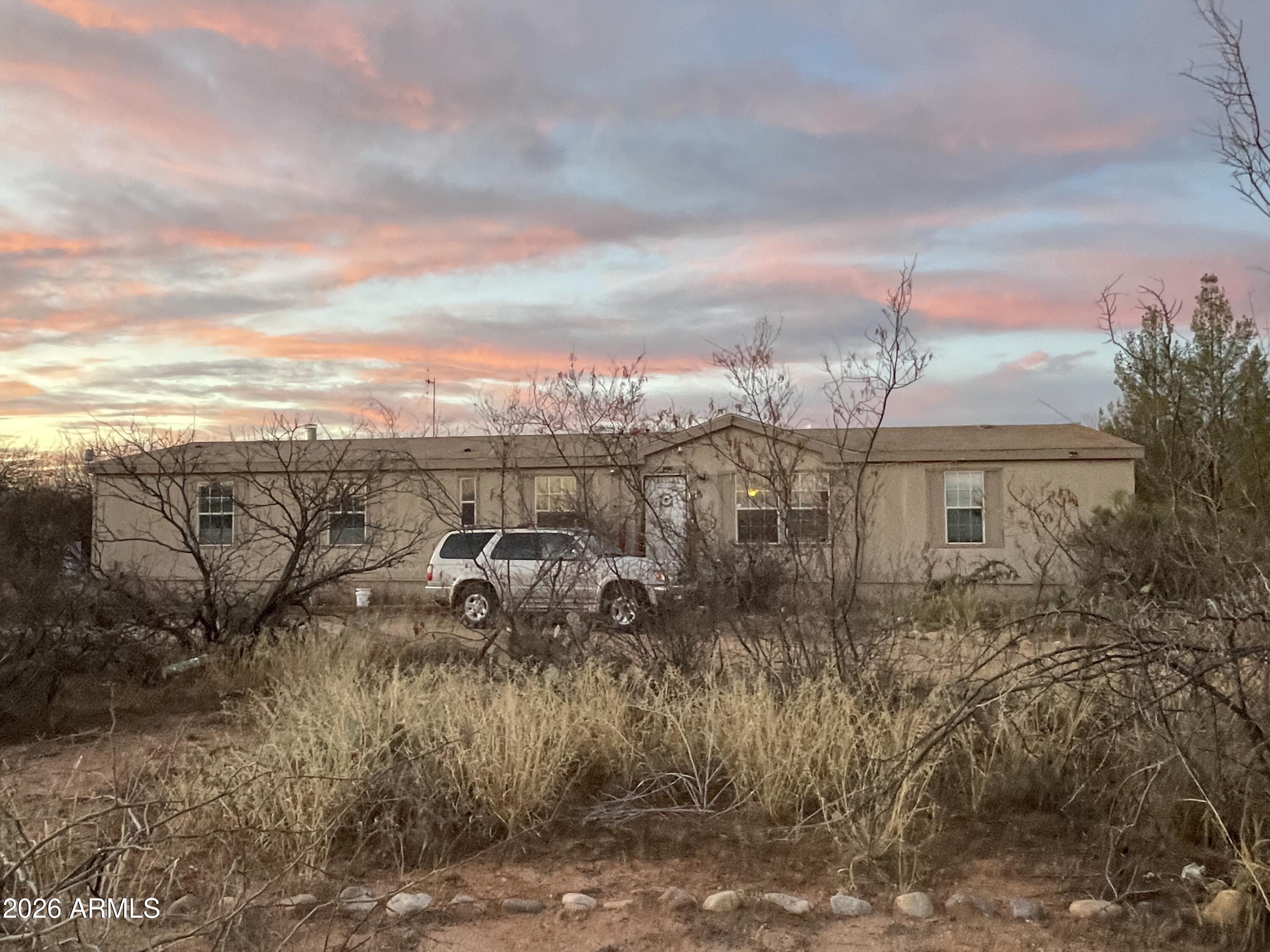 Large mobile on large lot.  Very attractive location with nice homes all around.  Convenient to town and nature.  REO sold AS-IS.