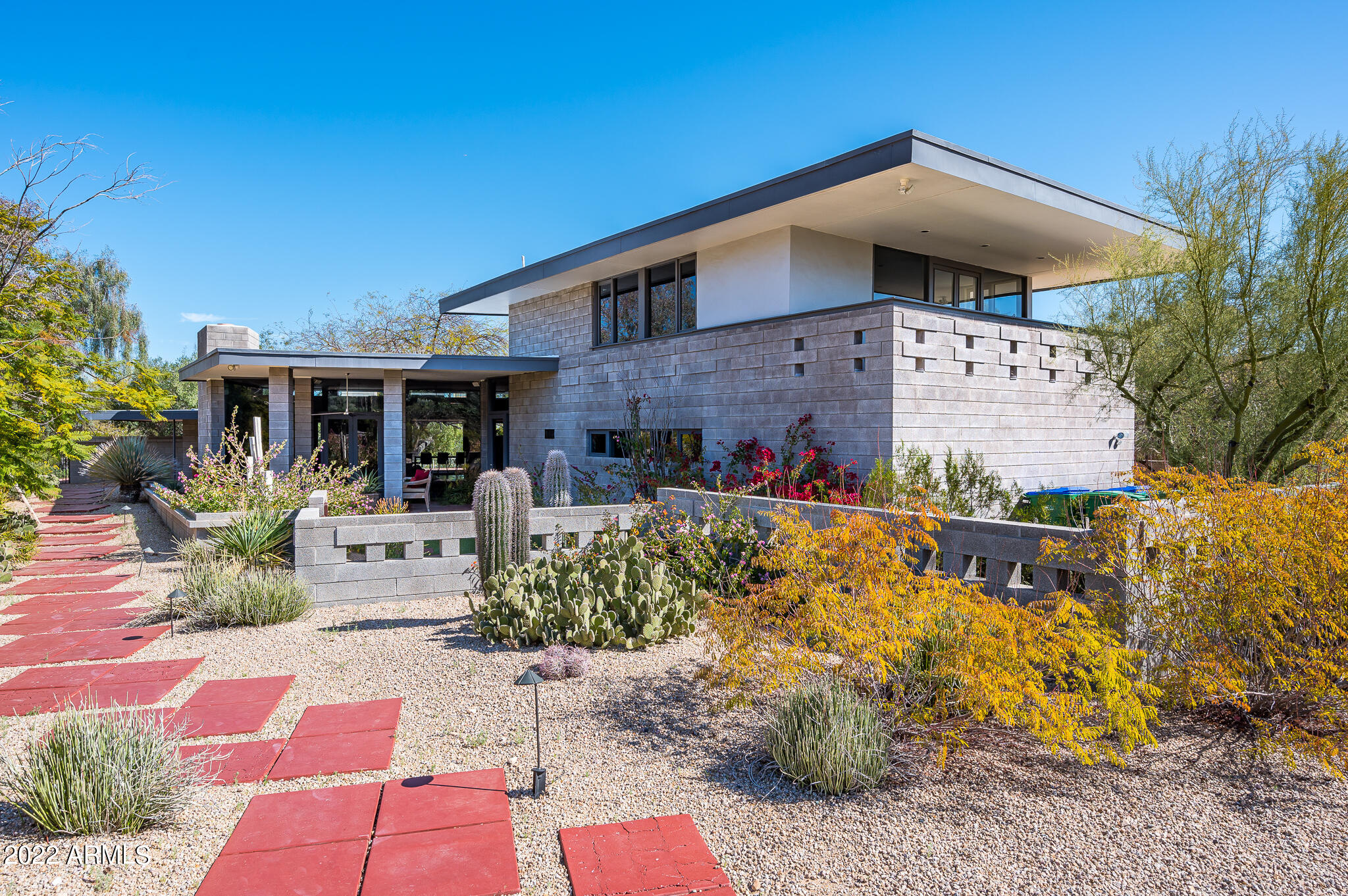 Frank Lloyd Wright apprentice Charles Montooth was the visionary and architect on this timeless modern oasis in the desert. This special lot is surrounded by incredible mountain views and 10 plus million dollar homes on all sides.  The home is an architectural masterpiece with floor to ceiling glass surrounded by an exposed block that Montooth was made famous for.  The property has been meticulously maintained and updated over the years but has kept the original architectural elements that make it so special.  Property owner has conceptual renderings for a remodel to add square footage.